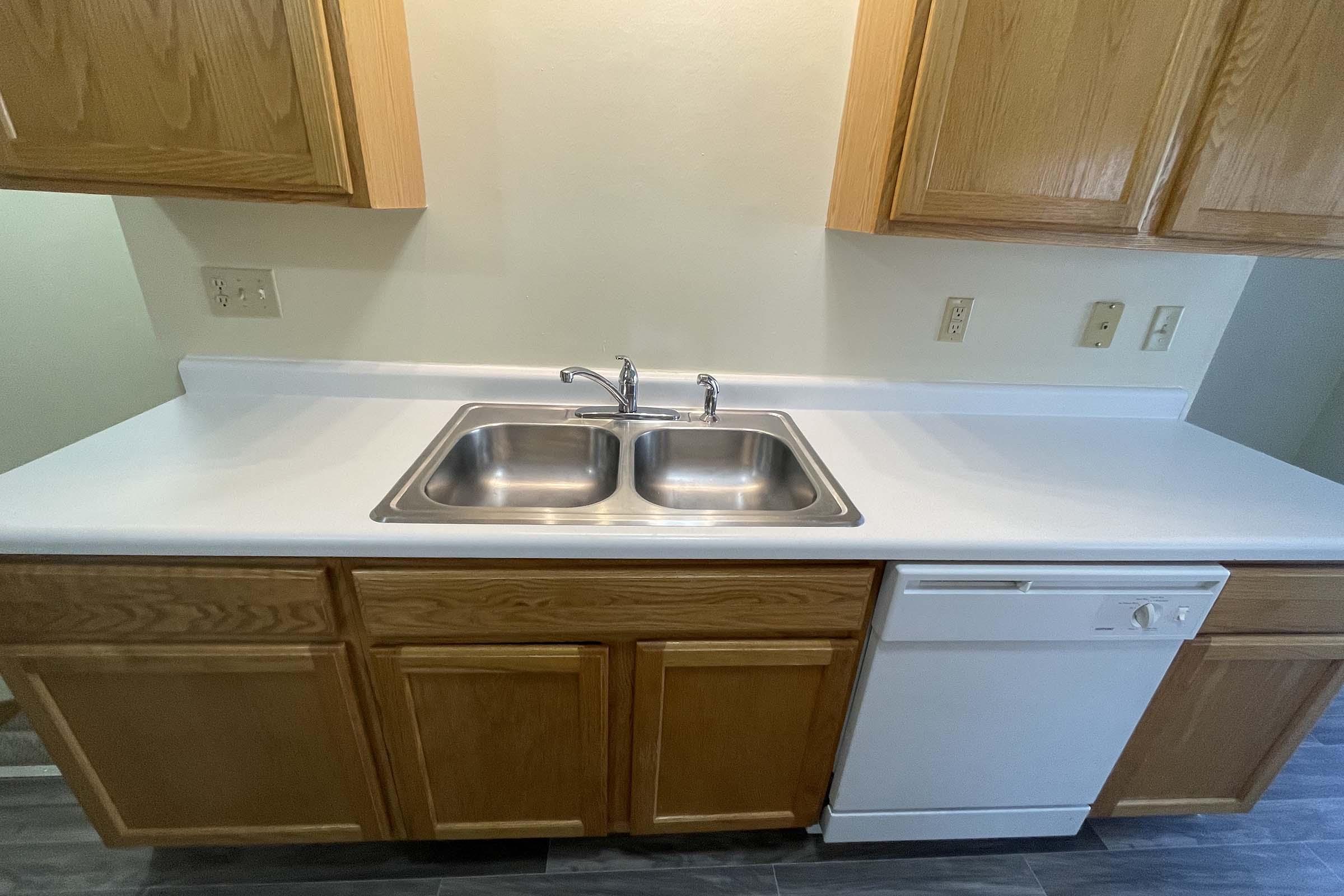 a kitchen with a stove top oven sitting next to a sink