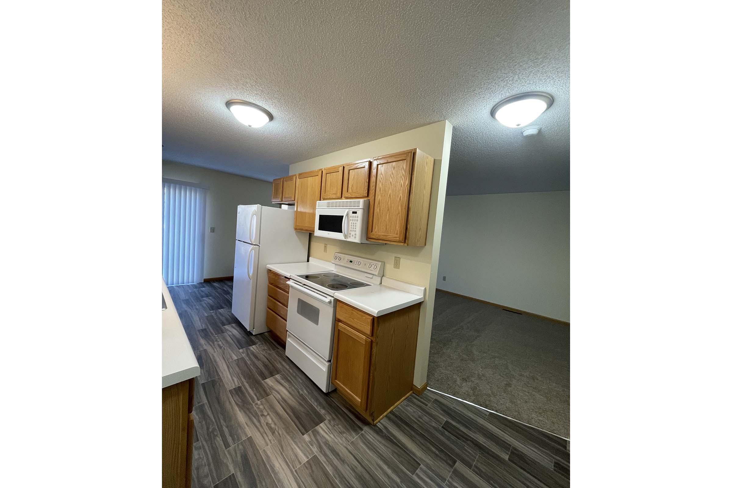 a kitchen with a stove top oven sitting inside of a building