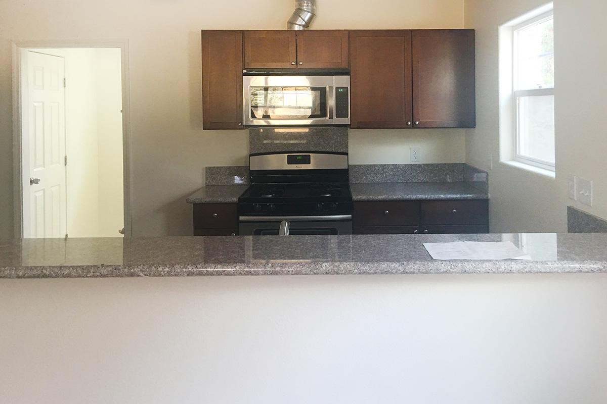 a stainless steel refrigerator in a kitchen