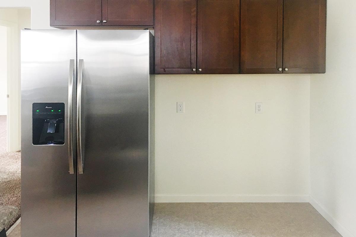 a stainless steel refrigerator in a kitchen