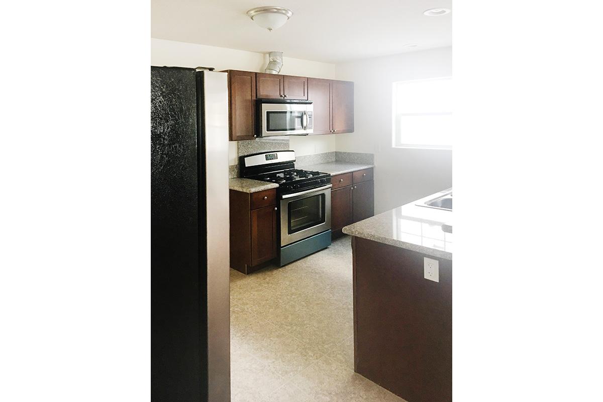 a stainless steel refrigerator in a kitchen