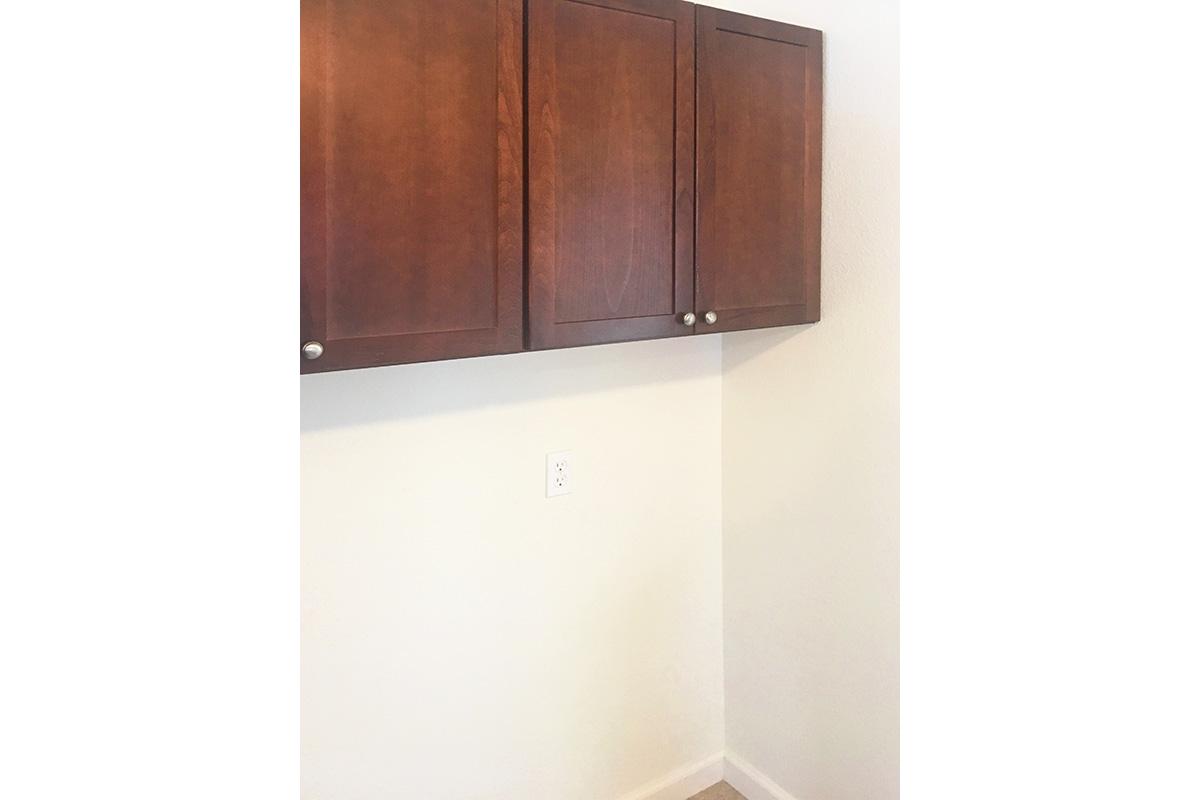 a white refrigerator freezer sitting inside of a kitchen