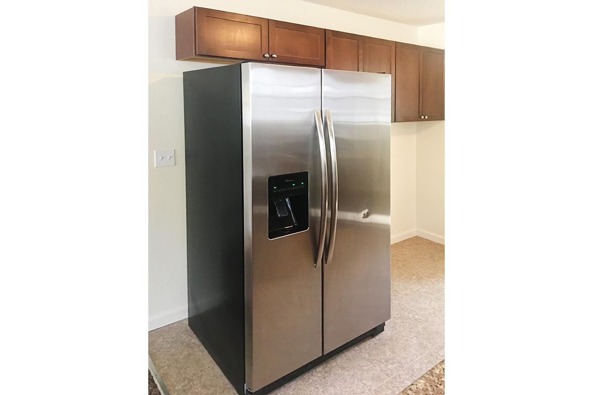 a stainless steel refrigerator in a kitchen