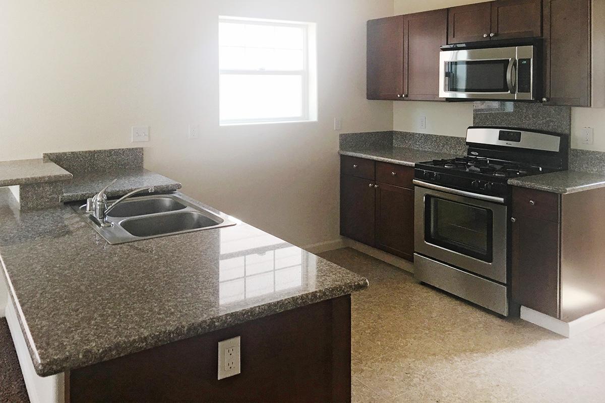 a modern kitchen with stainless steel appliances