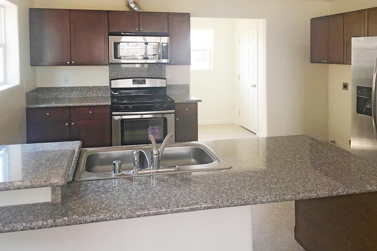 a modern kitchen with stainless steel appliances