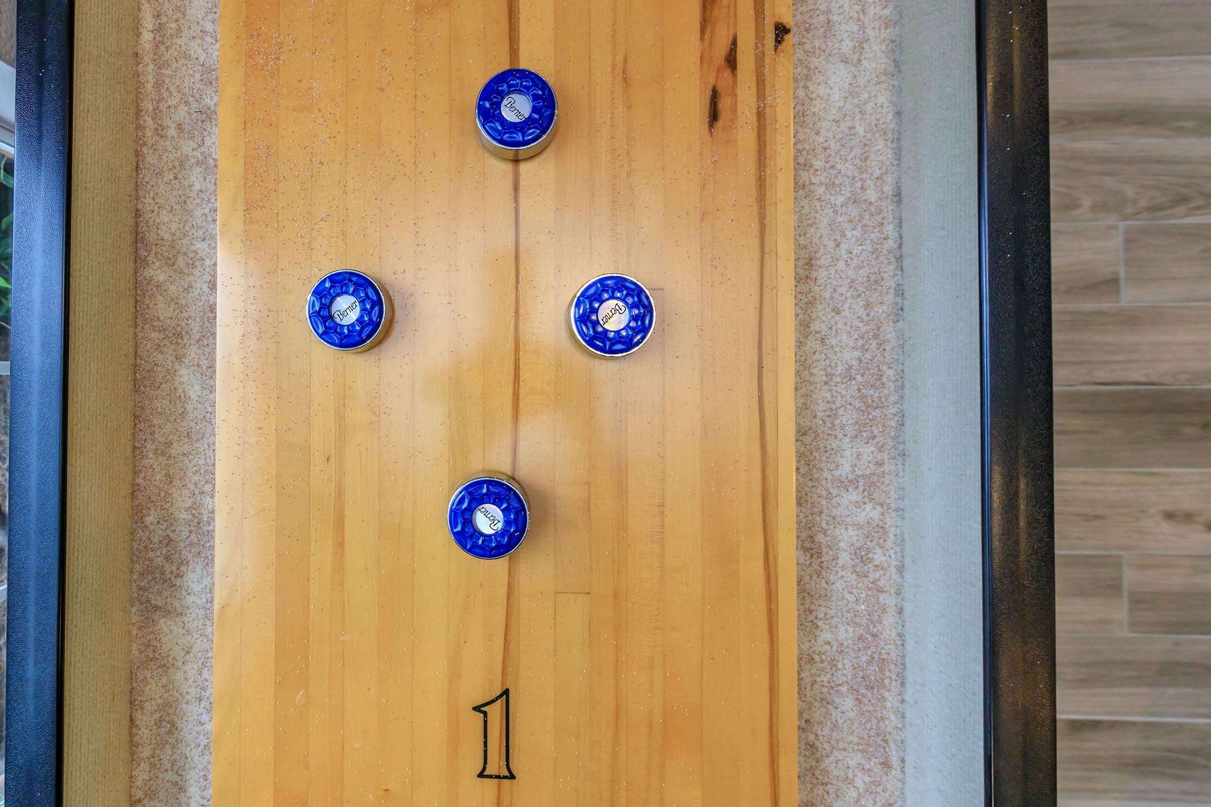 a clock on top of a wooden door