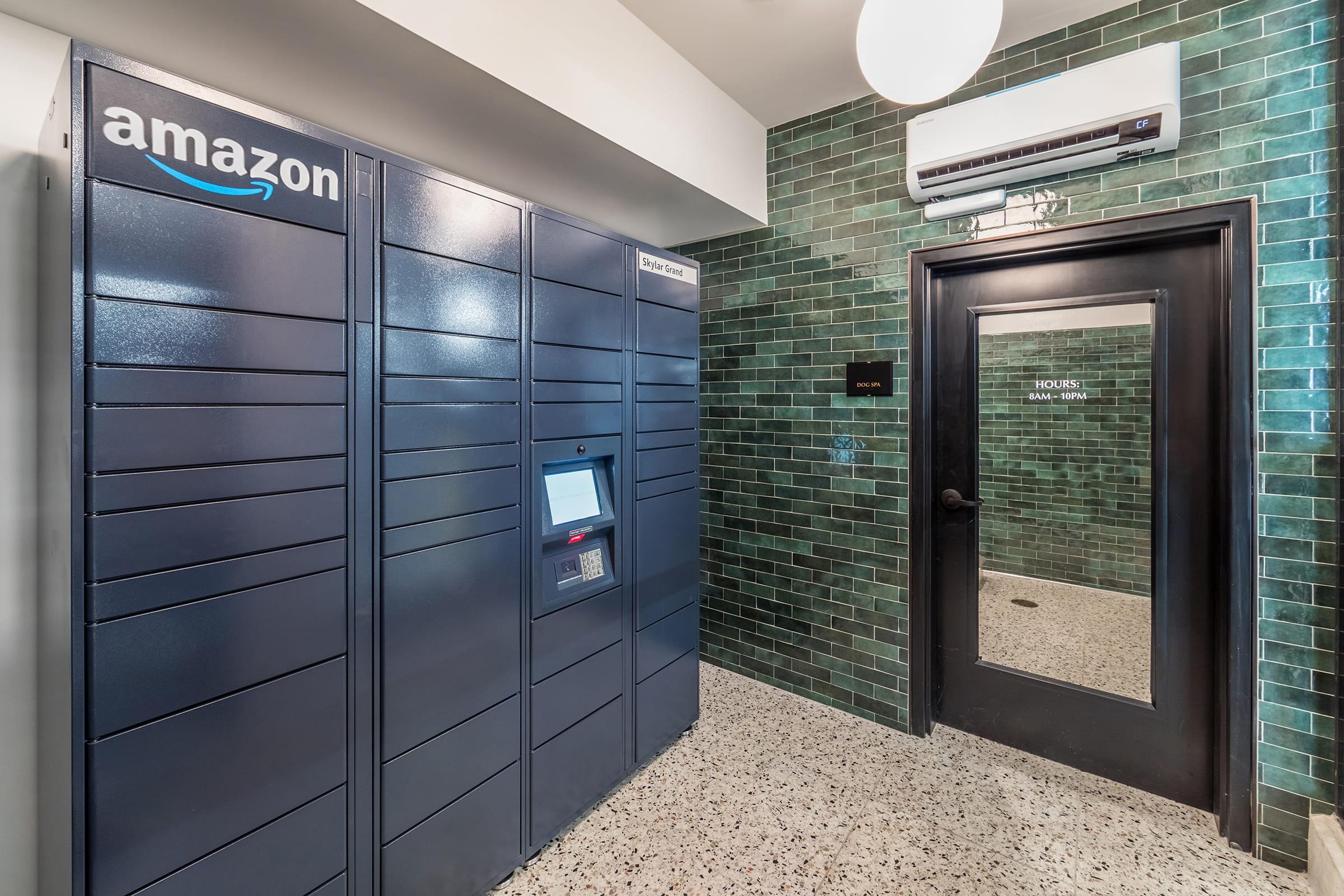 A modern interior featuring an Amazon locker system against a backdrop of green tiled walls.
