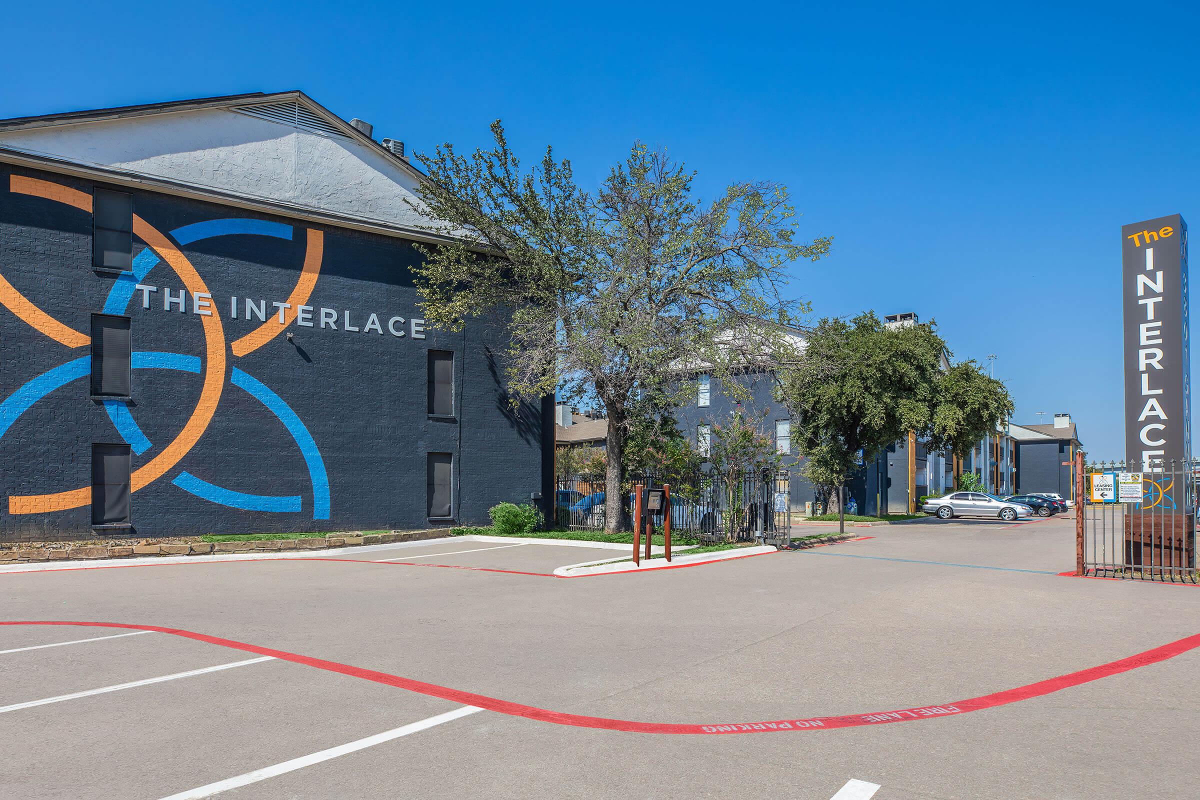 a close up of a basketball court in front of a building