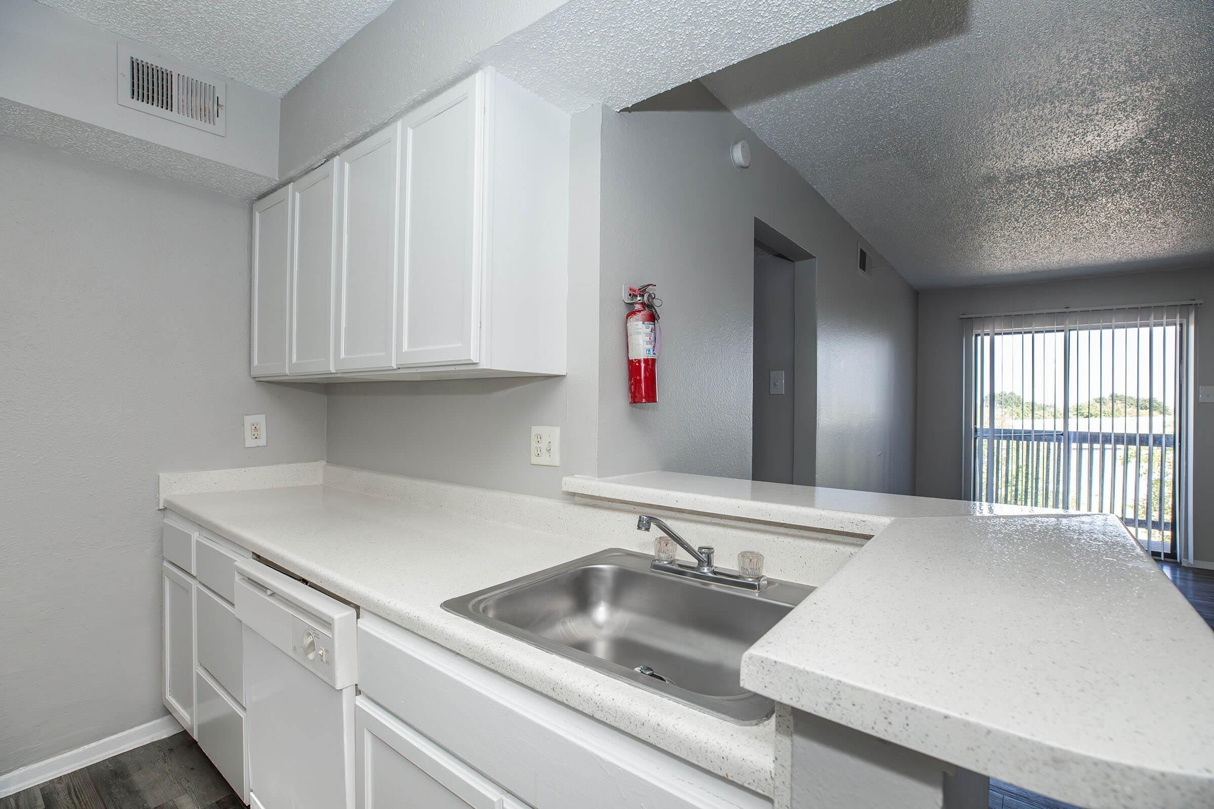 a kitchen with a sink and a window