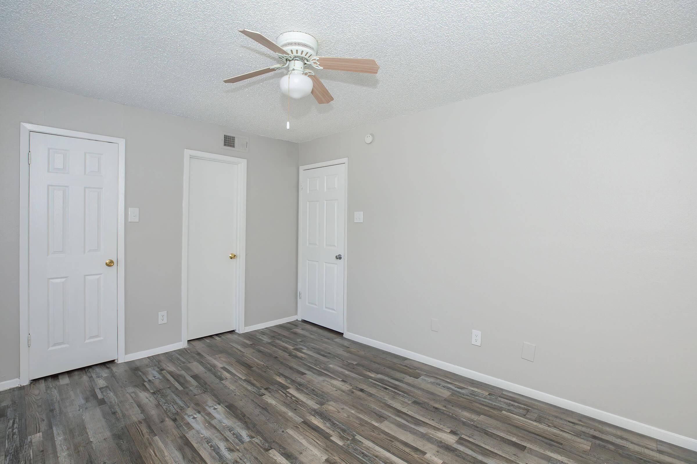 a kitchen with a wooden floor