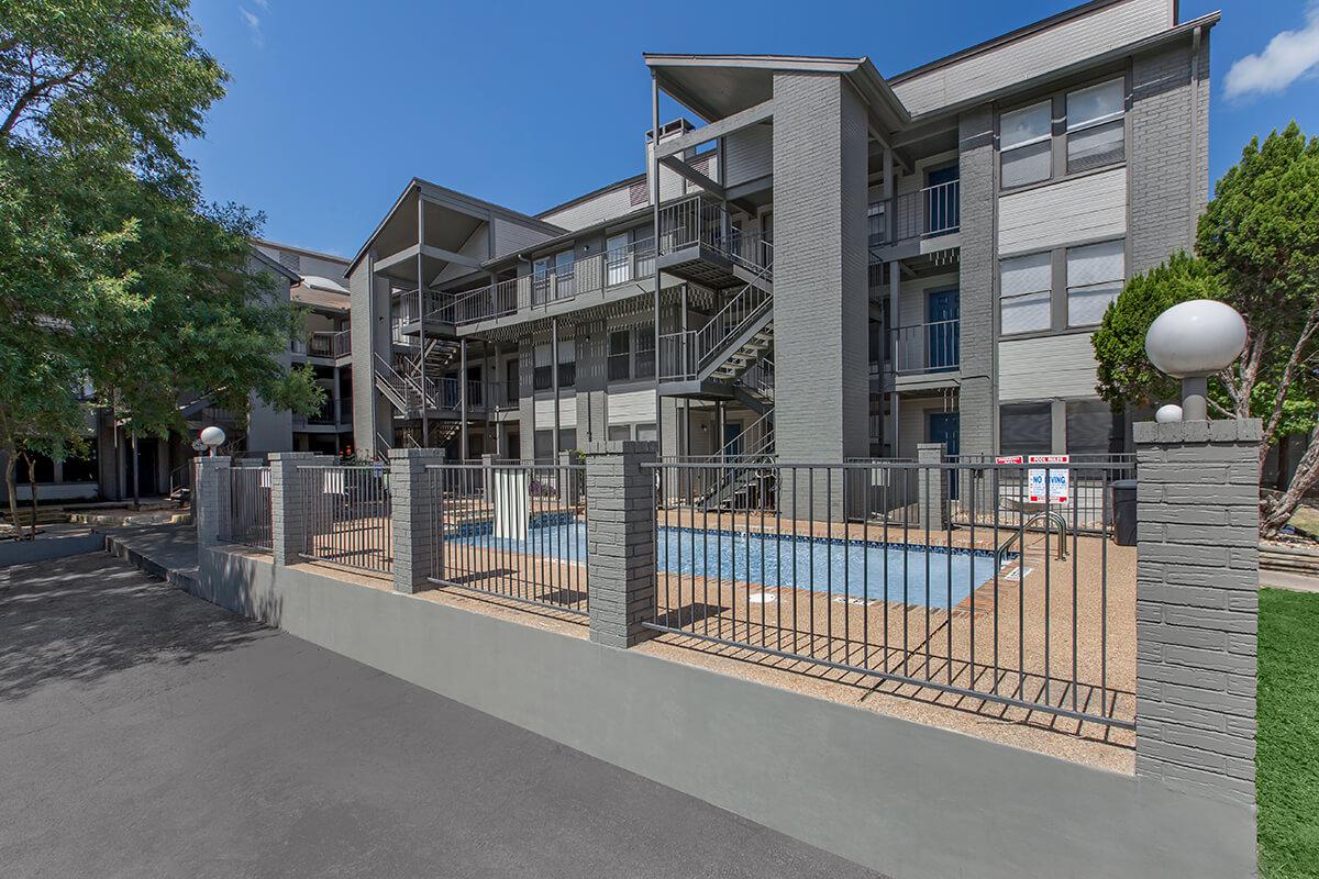 a building next to a fence