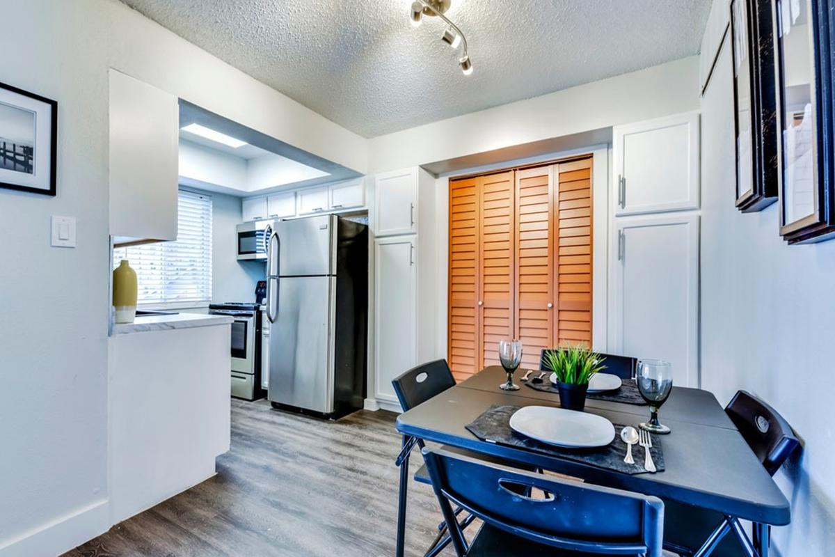 a kitchen with a dining room table