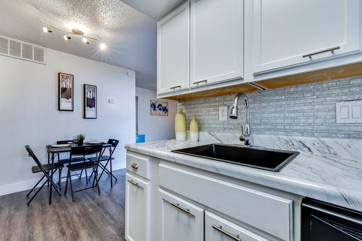 a kitchen with a stove and a sink