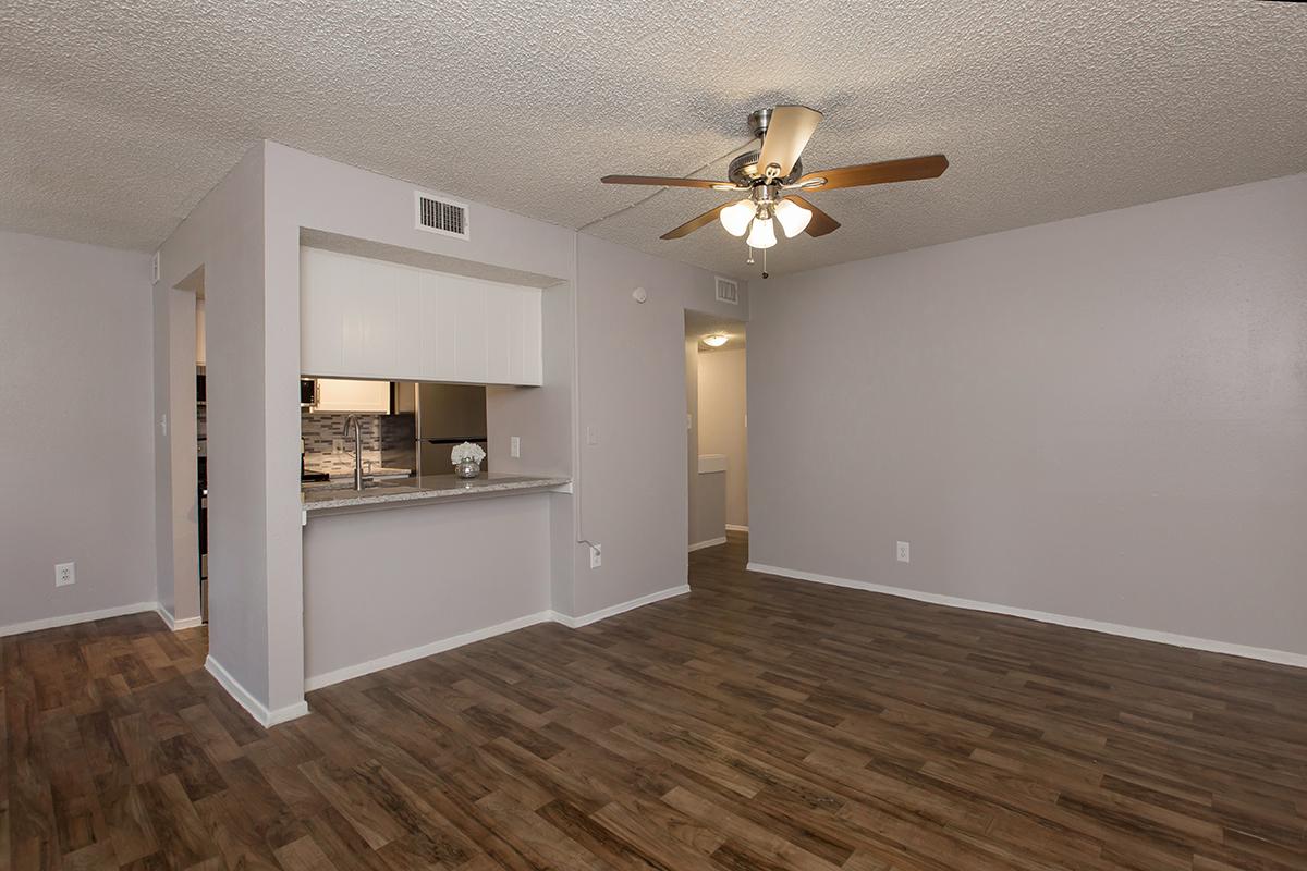 a large empty room with a wood floor