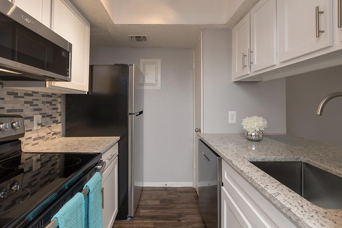 a large kitchen with stainless steel appliances