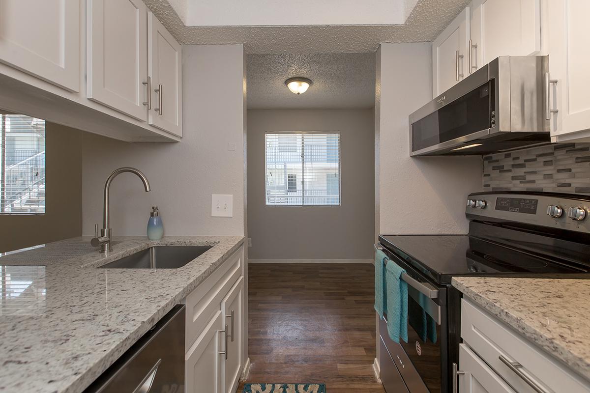 a kitchen with a sink and a window