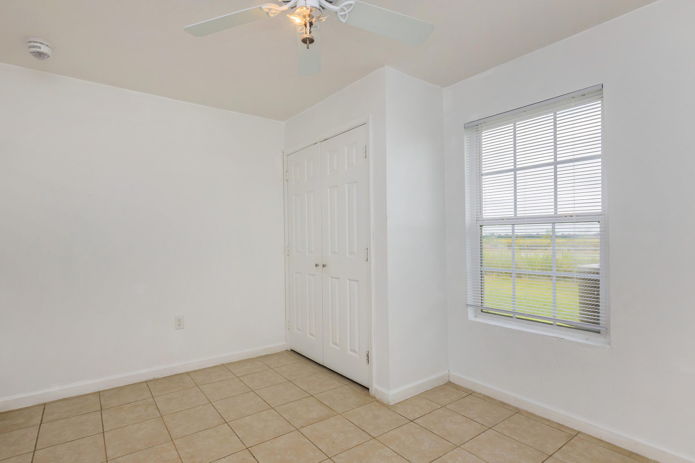 a kitchen with a tile floor