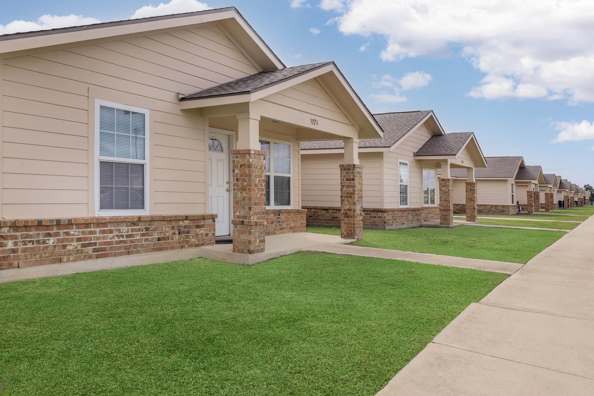 a large lawn in front of a house