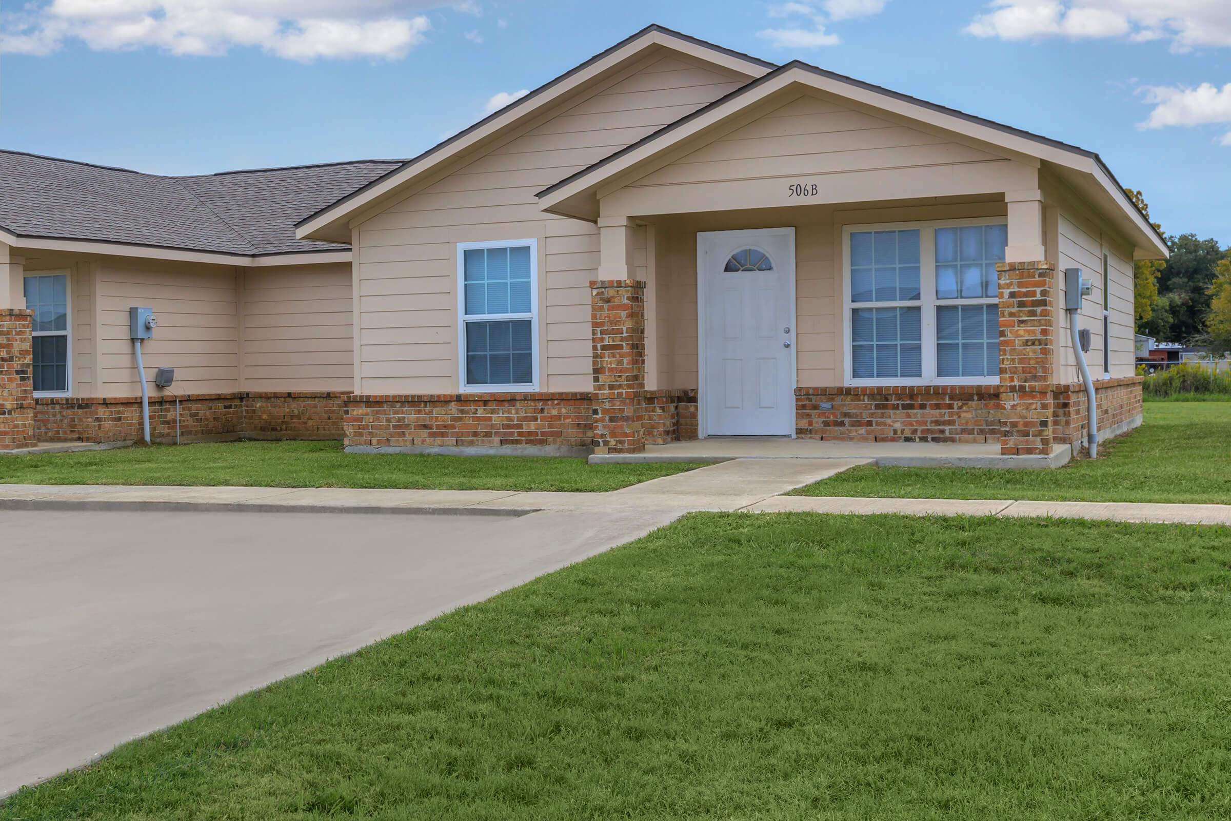 a large lawn in front of a house