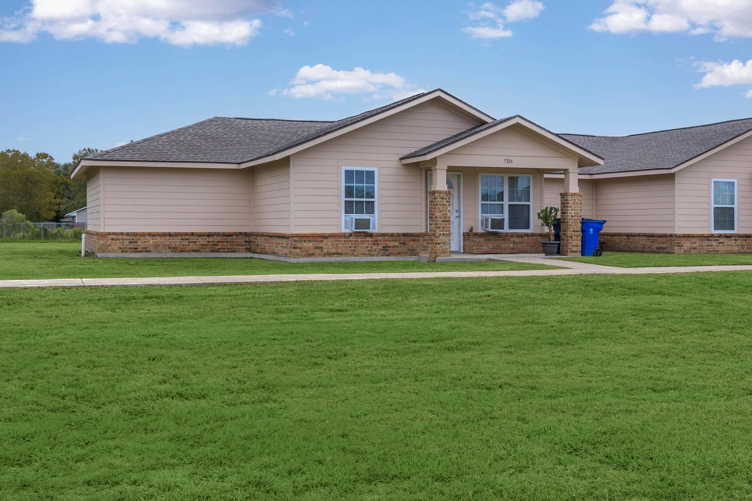 a large lawn in front of a house