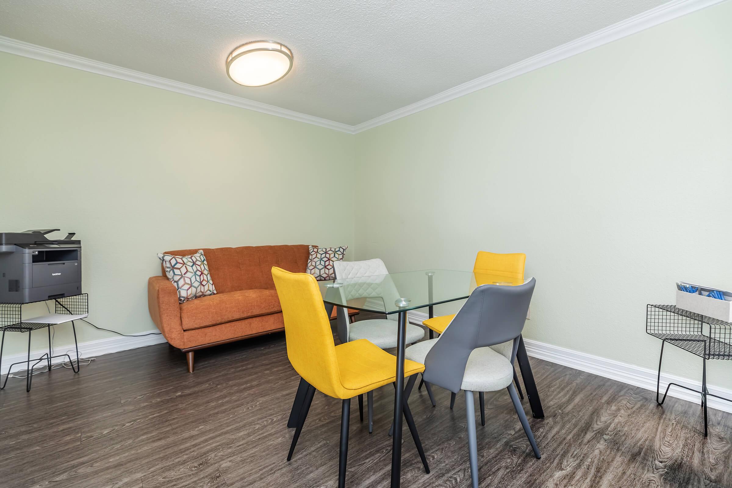 a living room with a leather chair