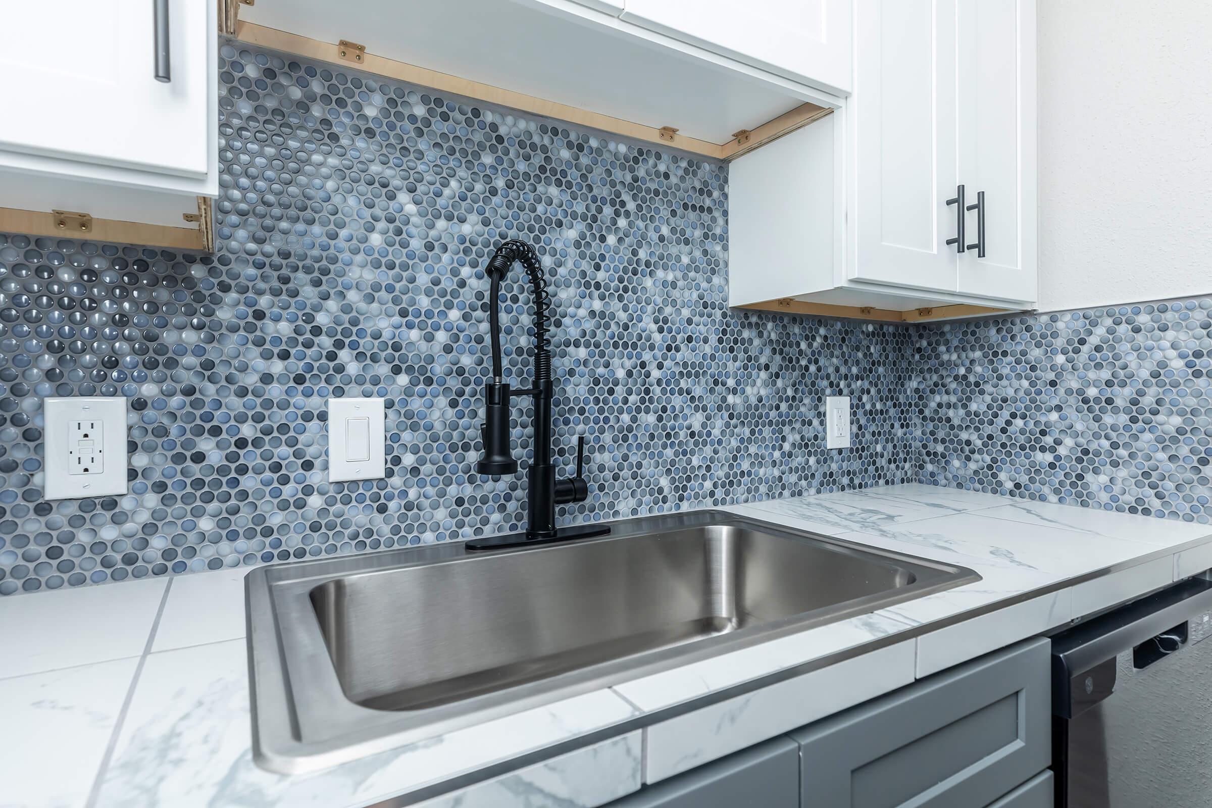 a kitchen with a stove and a sink