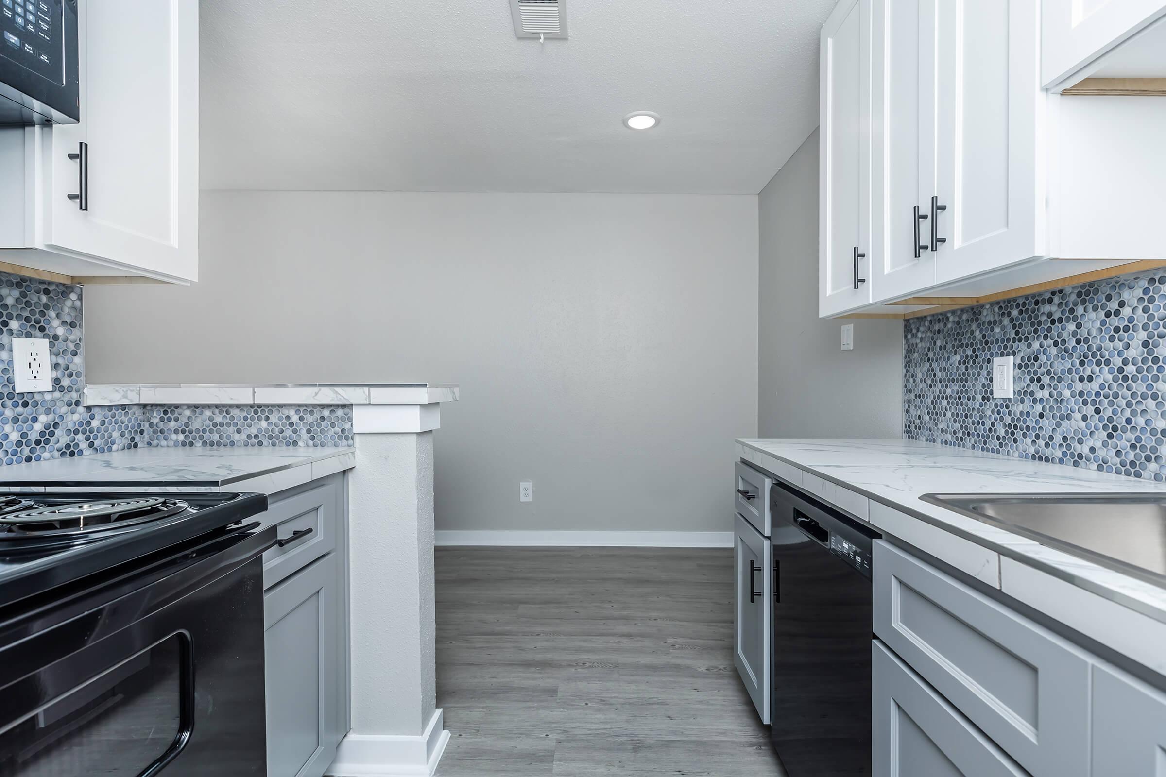 a kitchen with a stove and a sink