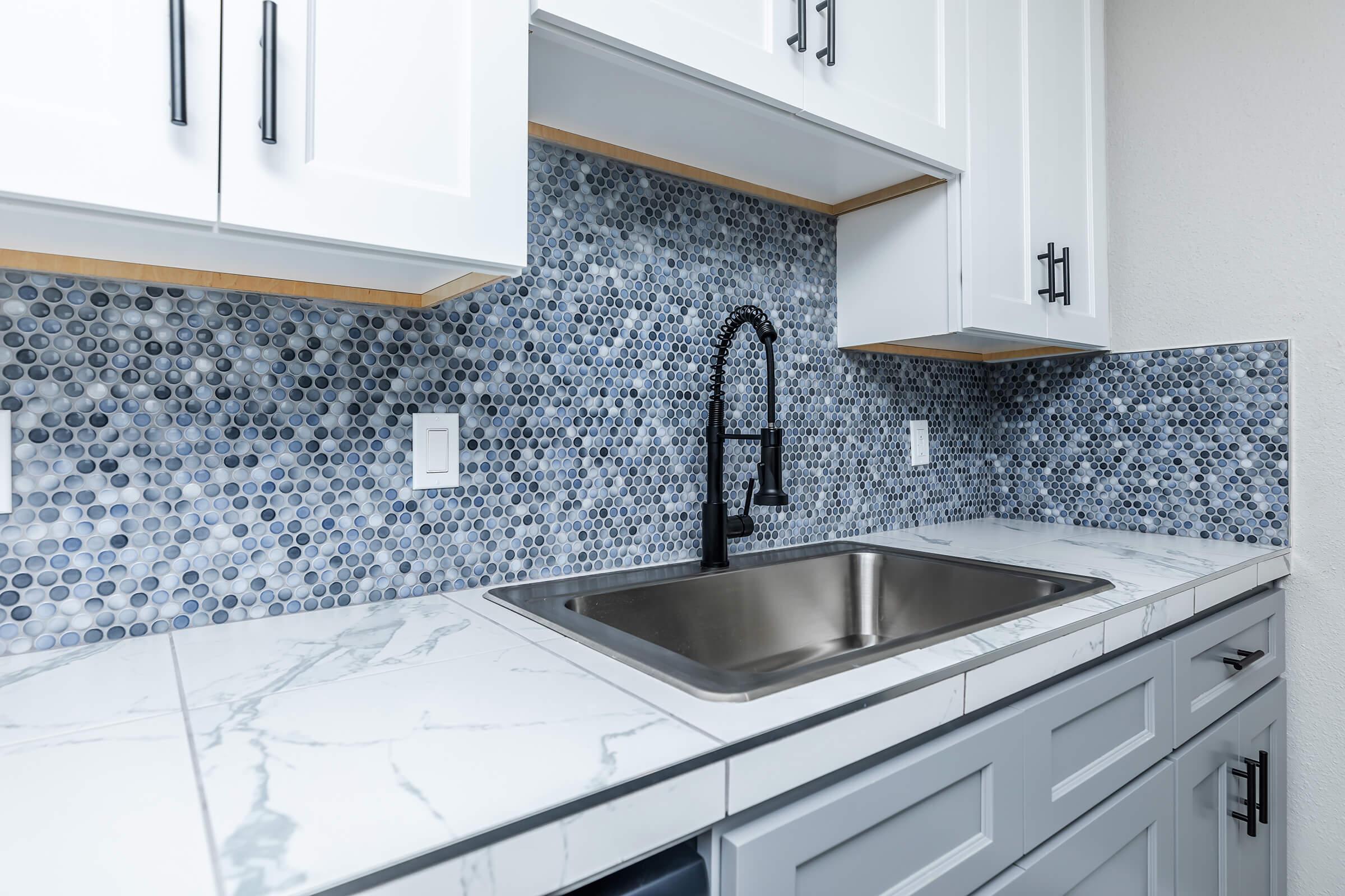 a kitchen with a stove and a sink