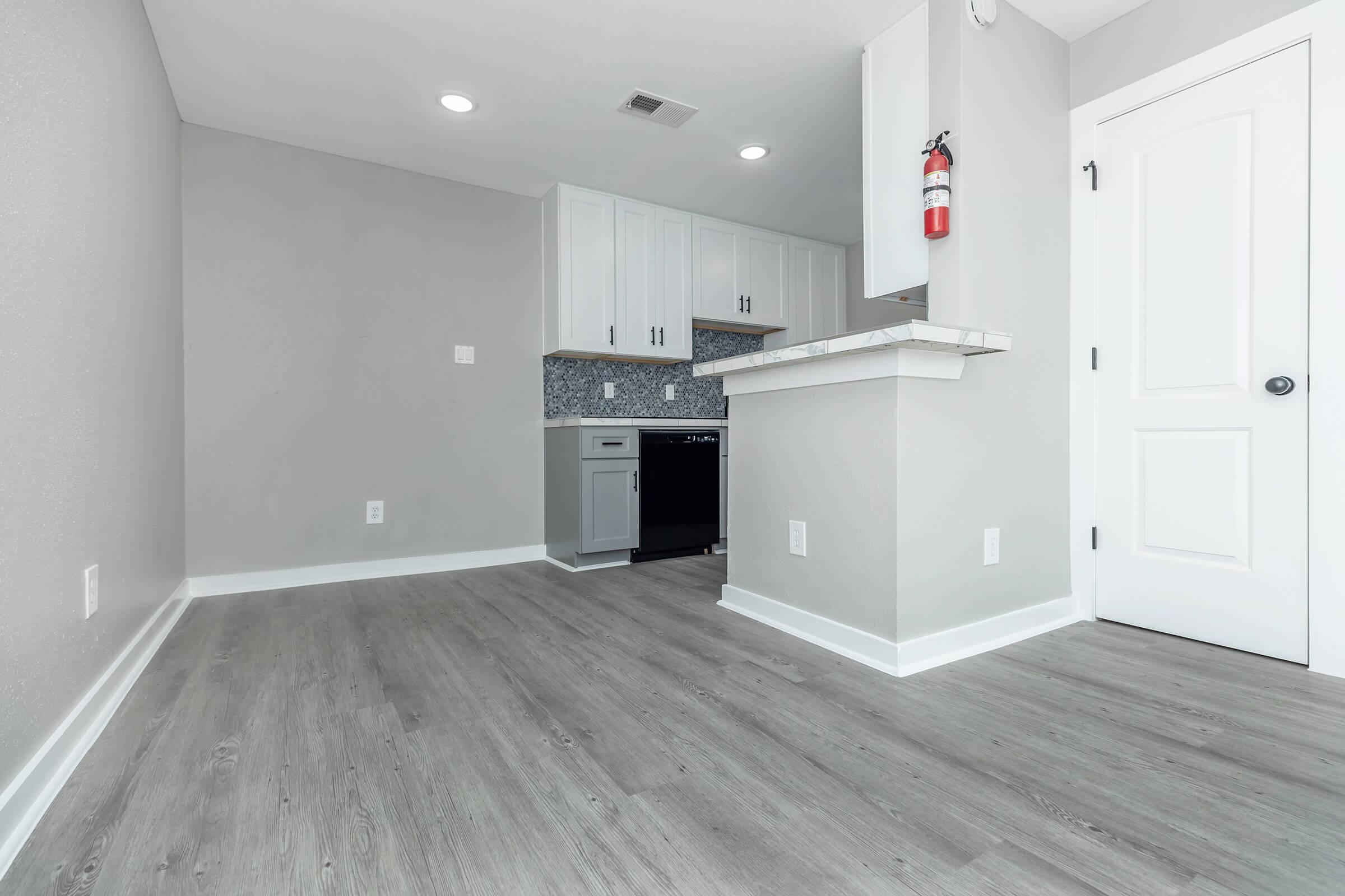 a kitchen with a wooden floor