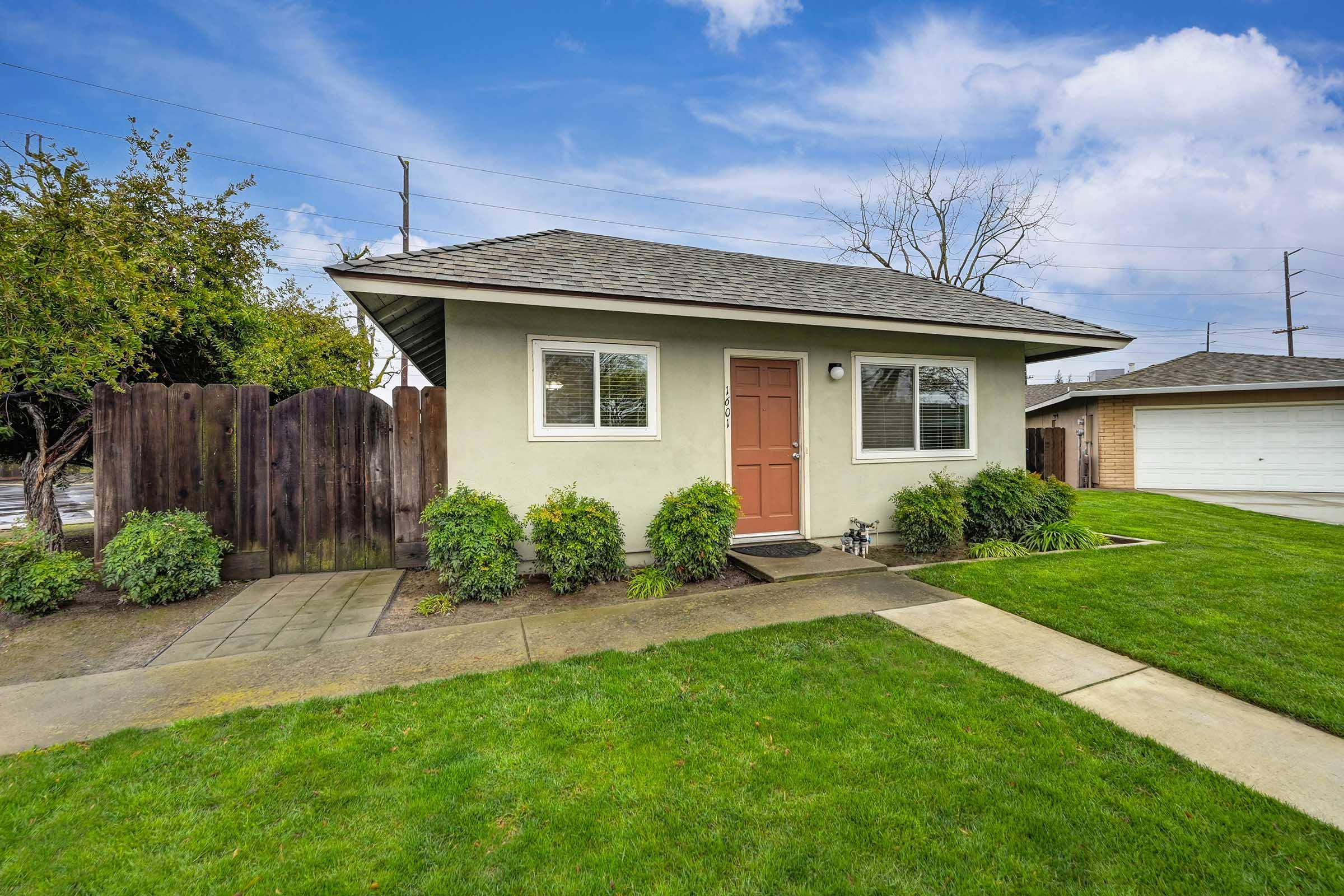 home exterior with lawn and landscaping