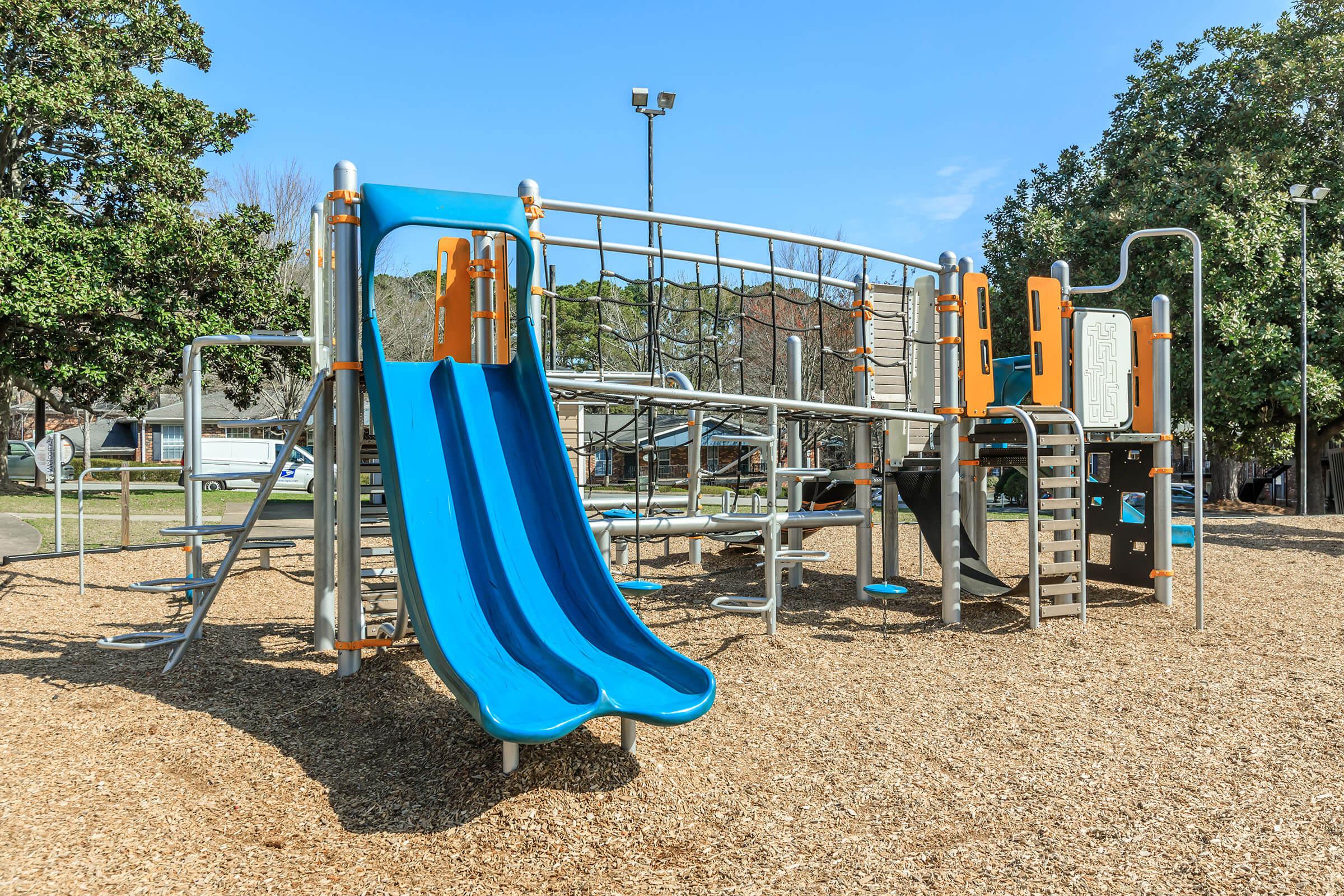 a playground with a blue chair