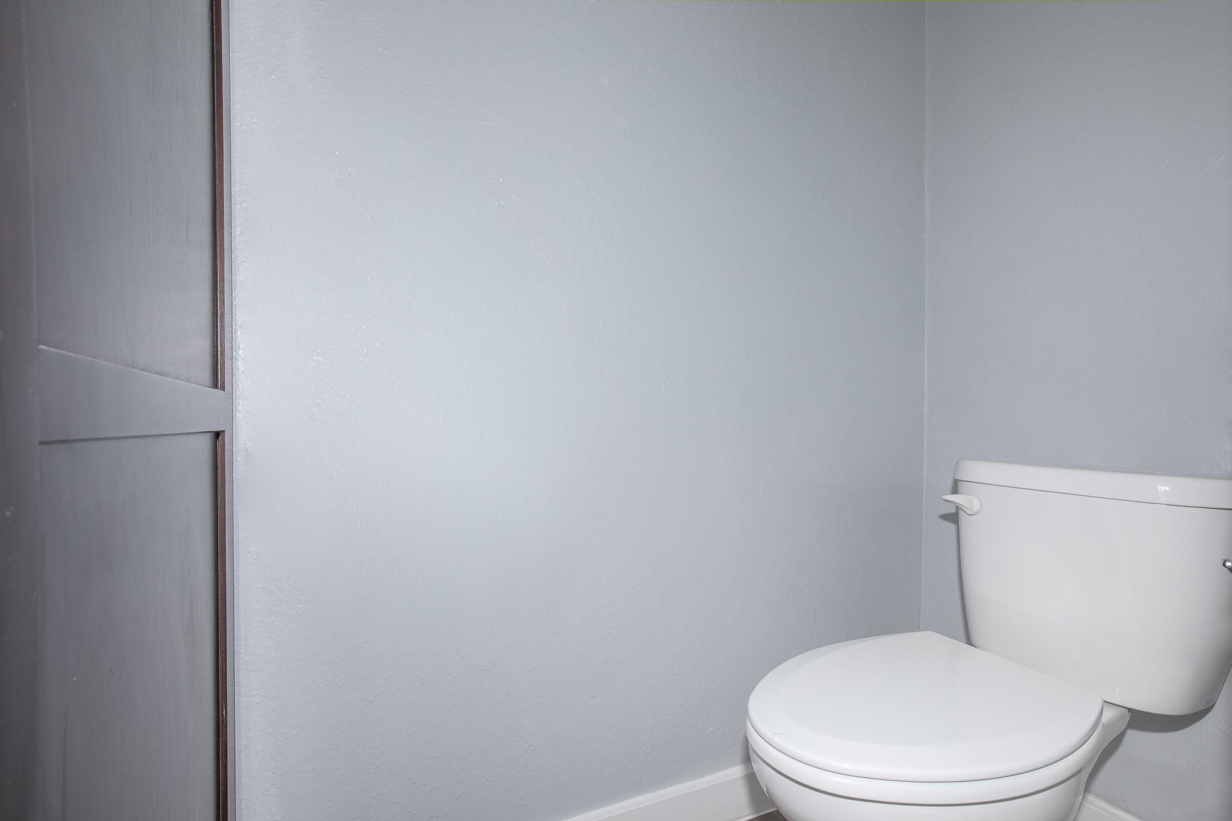 a white sink sitting next to a door