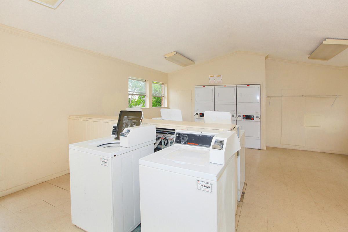 a white refrigerator freezer sitting inside of a kitchen