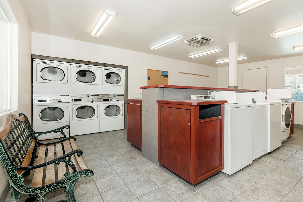 a kitchen with a stove top oven sitting inside of a room