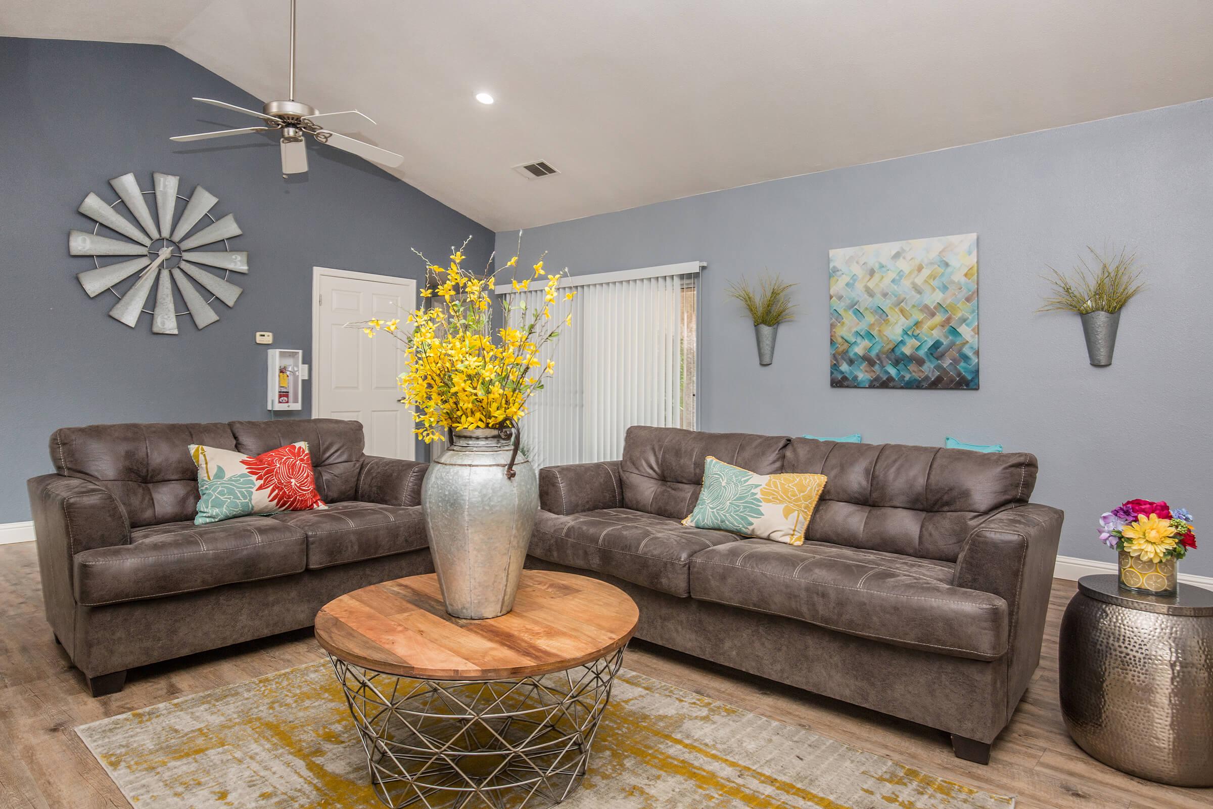 a living room filled with furniture and a fire place