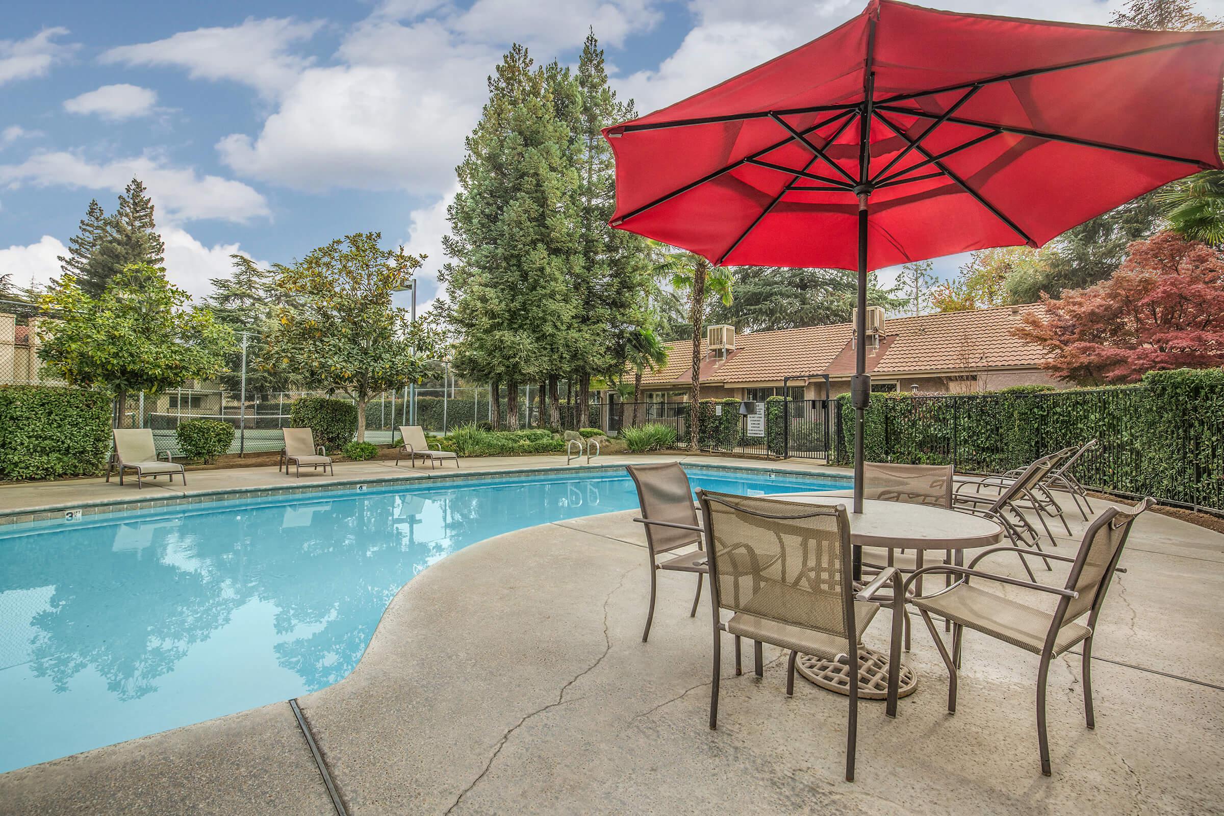 a pool next to an umbrella