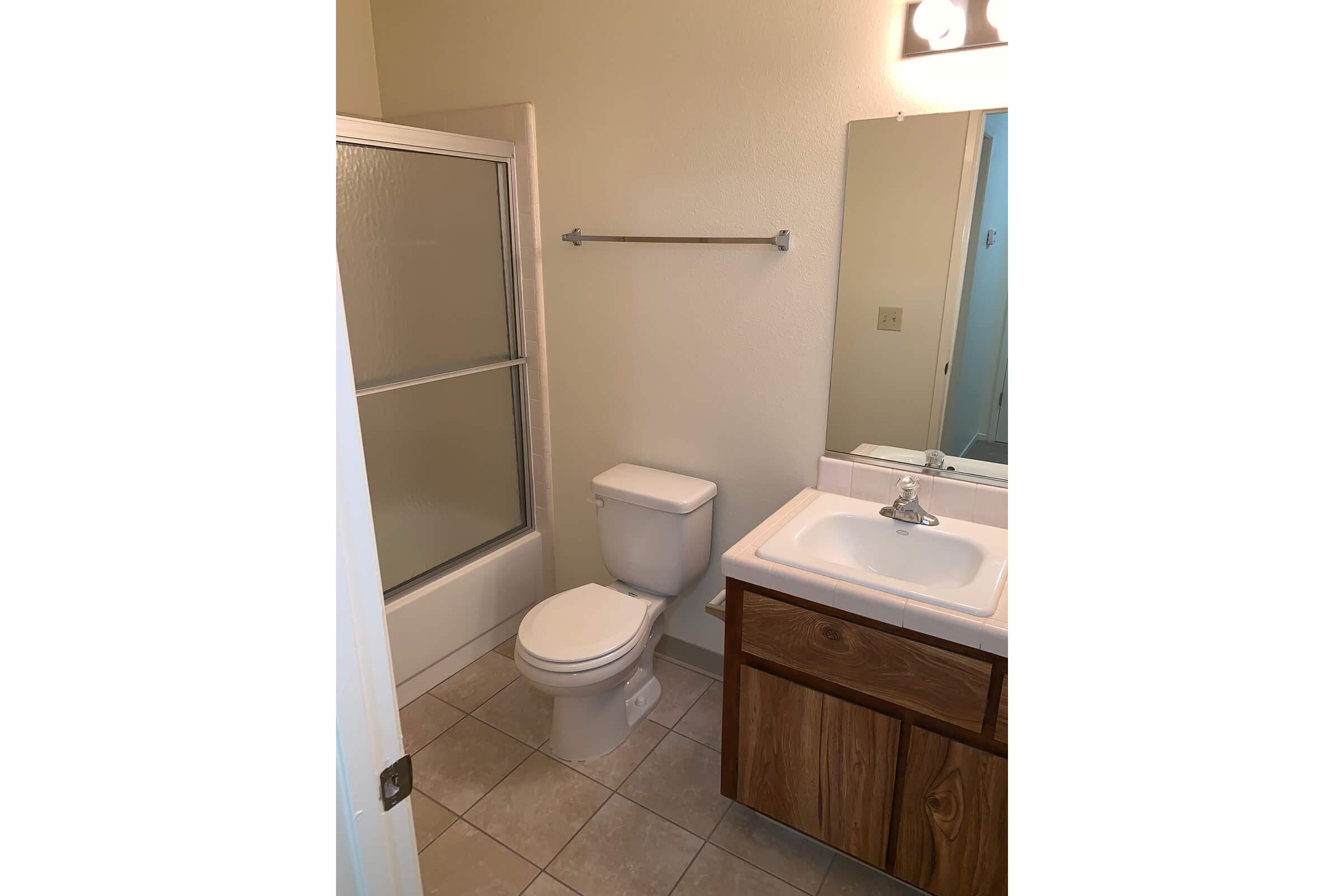 a small white sink in a bathroom