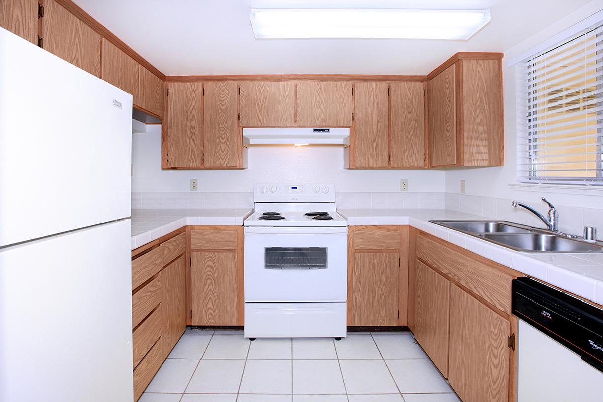 a kitchen with a stove top oven sitting inside of a refrigerator