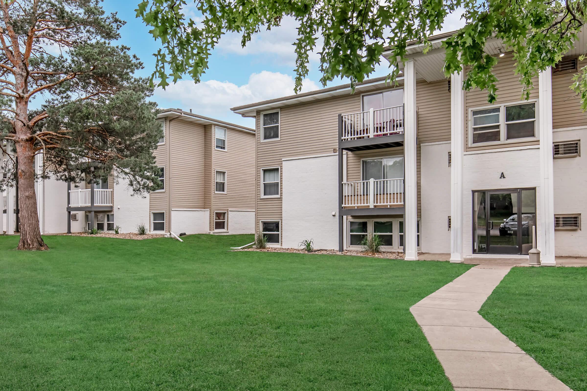 Side angle of renovated apartment buildings with balconies at Bexley in Urbandale, Iowa.