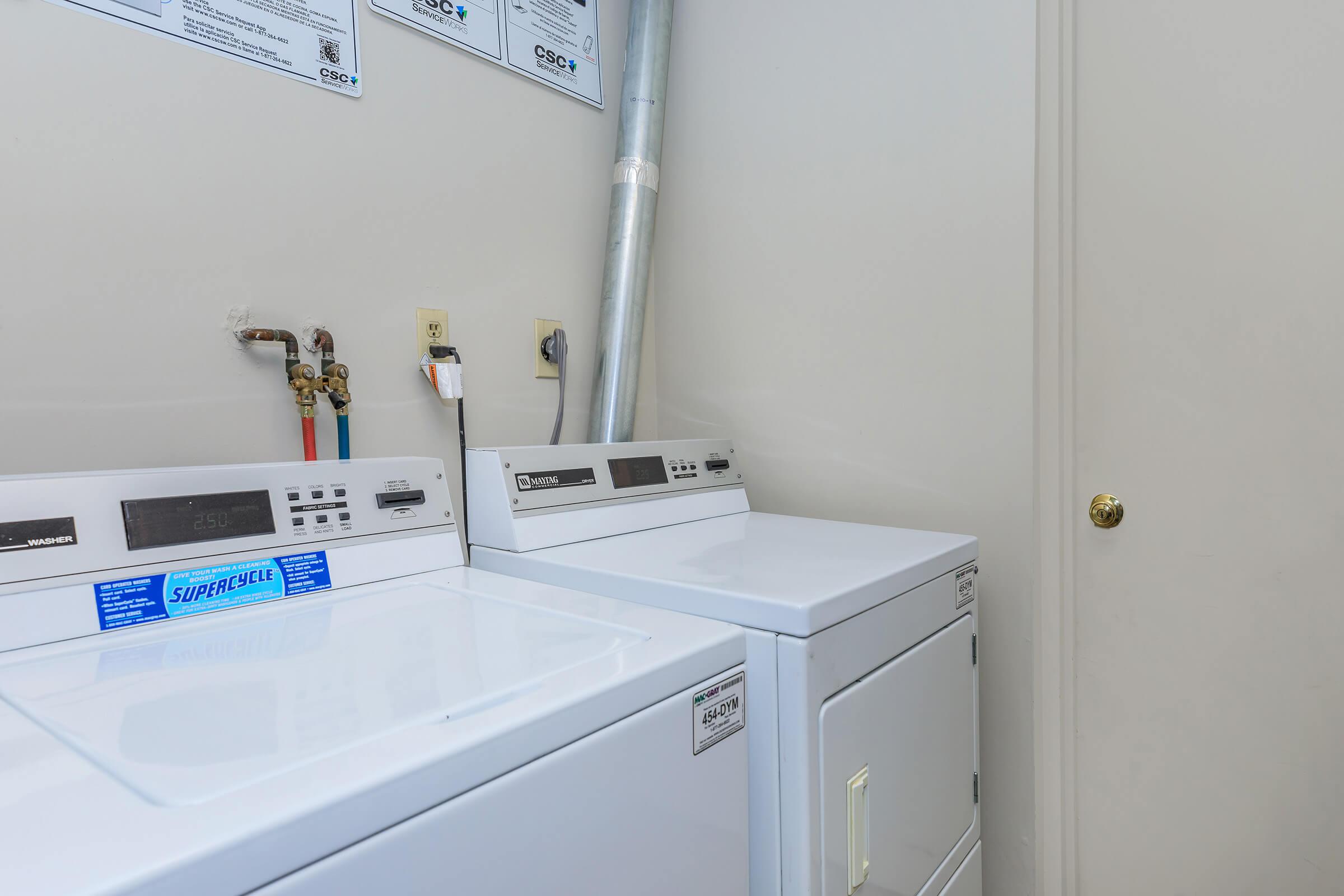 a kitchen with a sink and a refrigerator