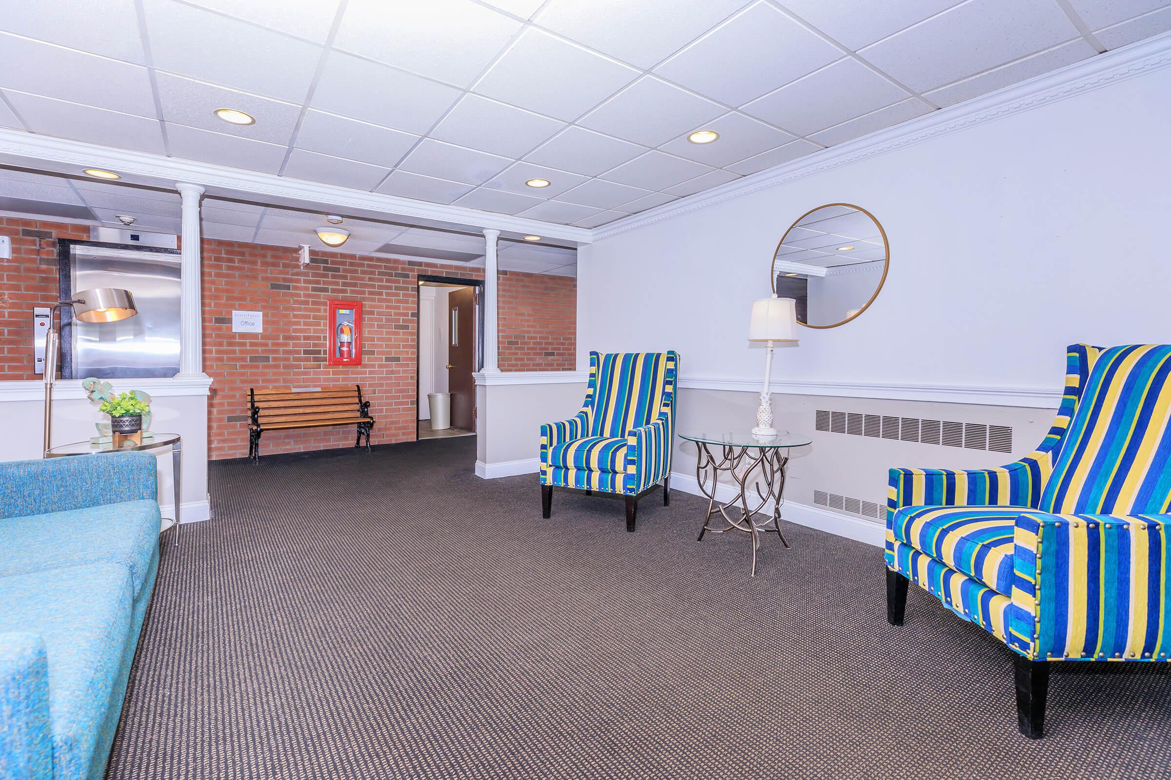 a room filled with furniture and a blue chair