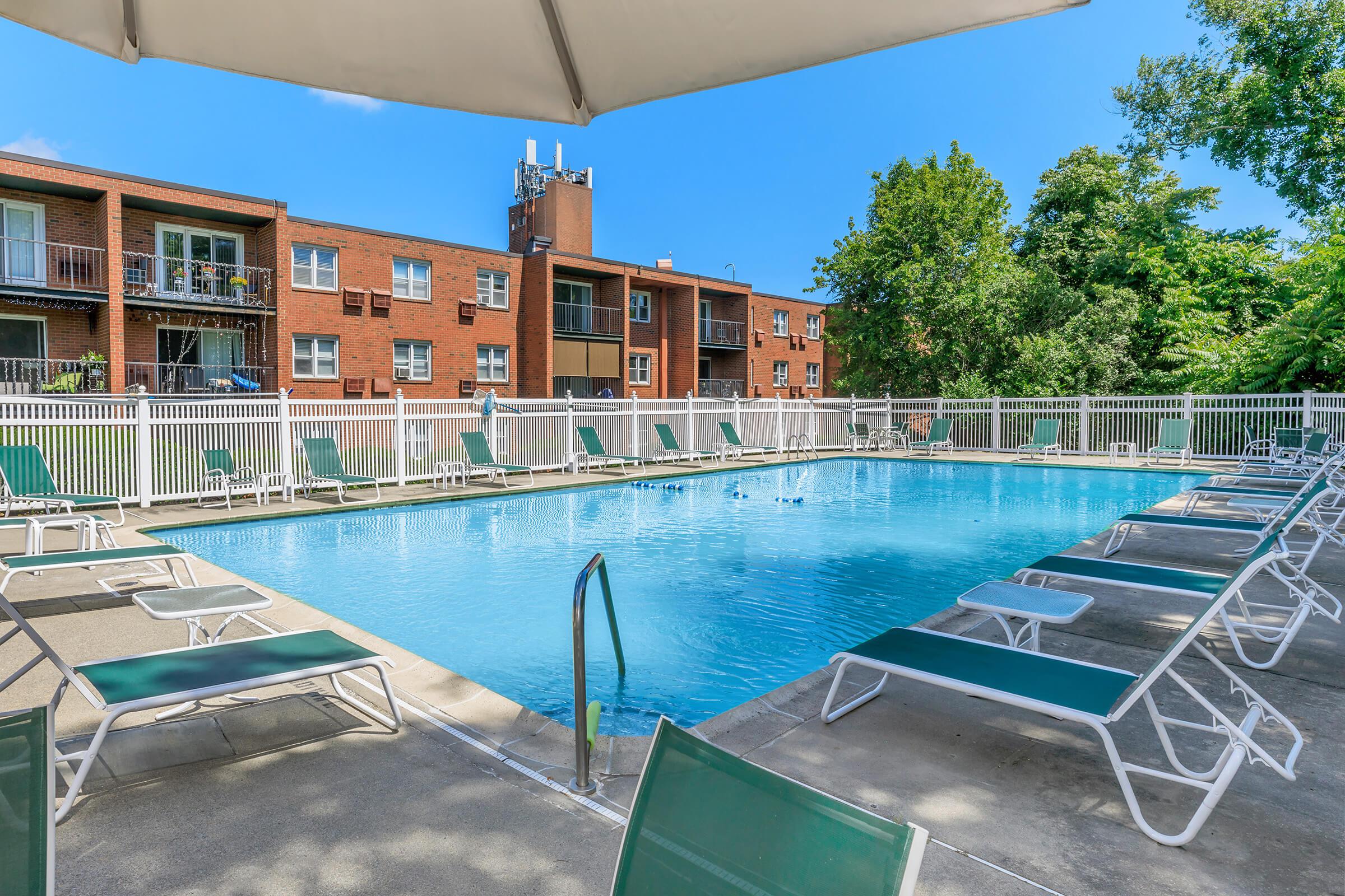 a chair sitting in front of a pool