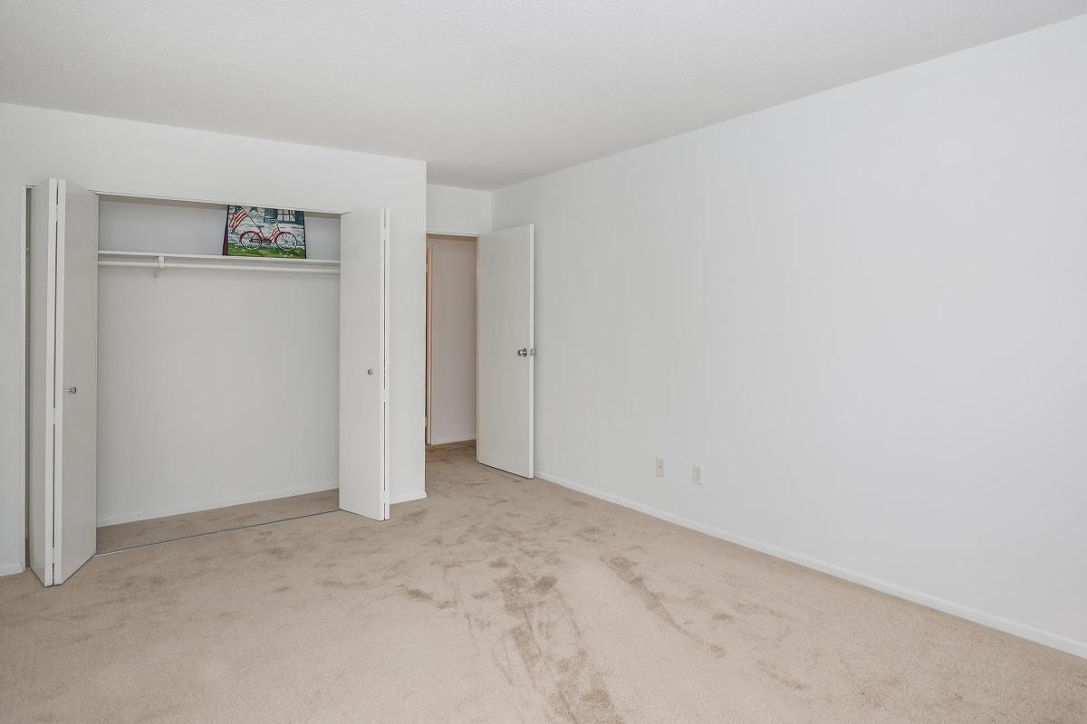 a white refrigerator freezer sitting inside of a building