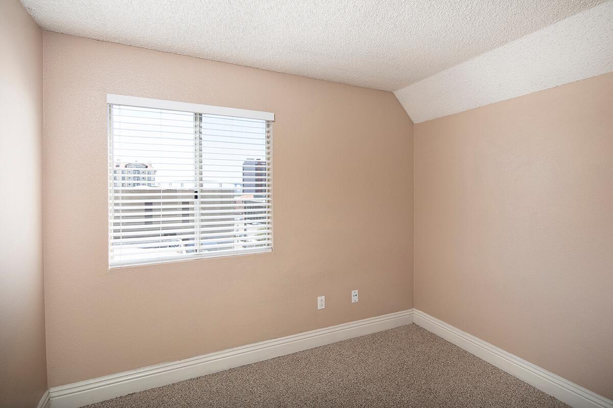a bedroom with a bed and a mirror