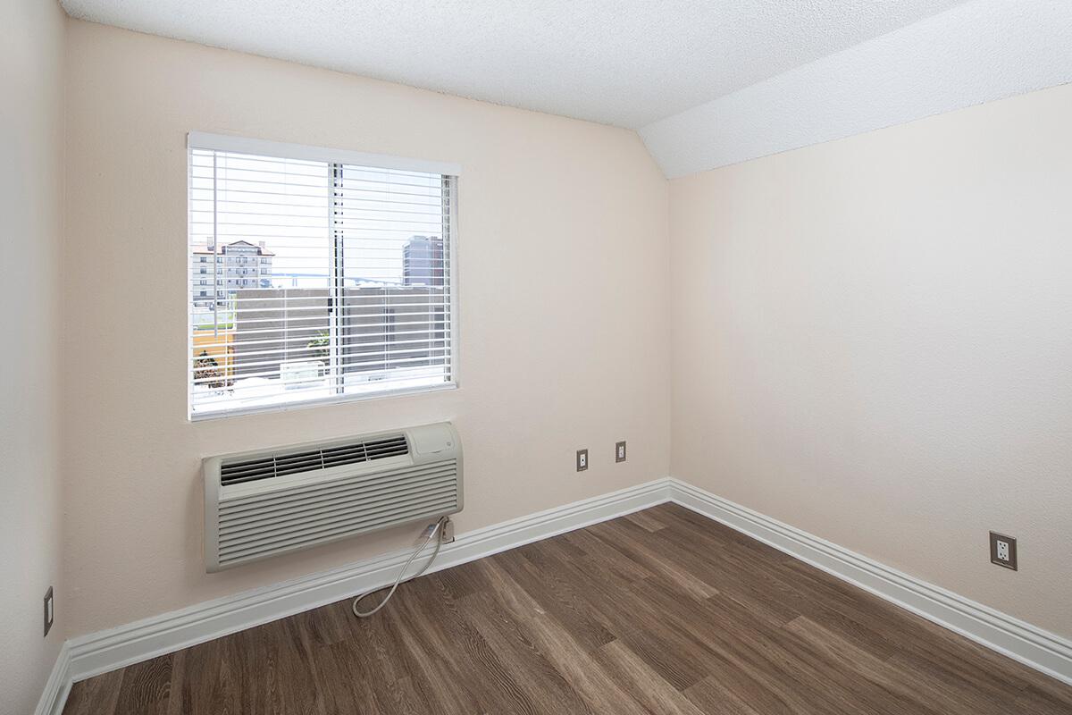a bedroom with a large window