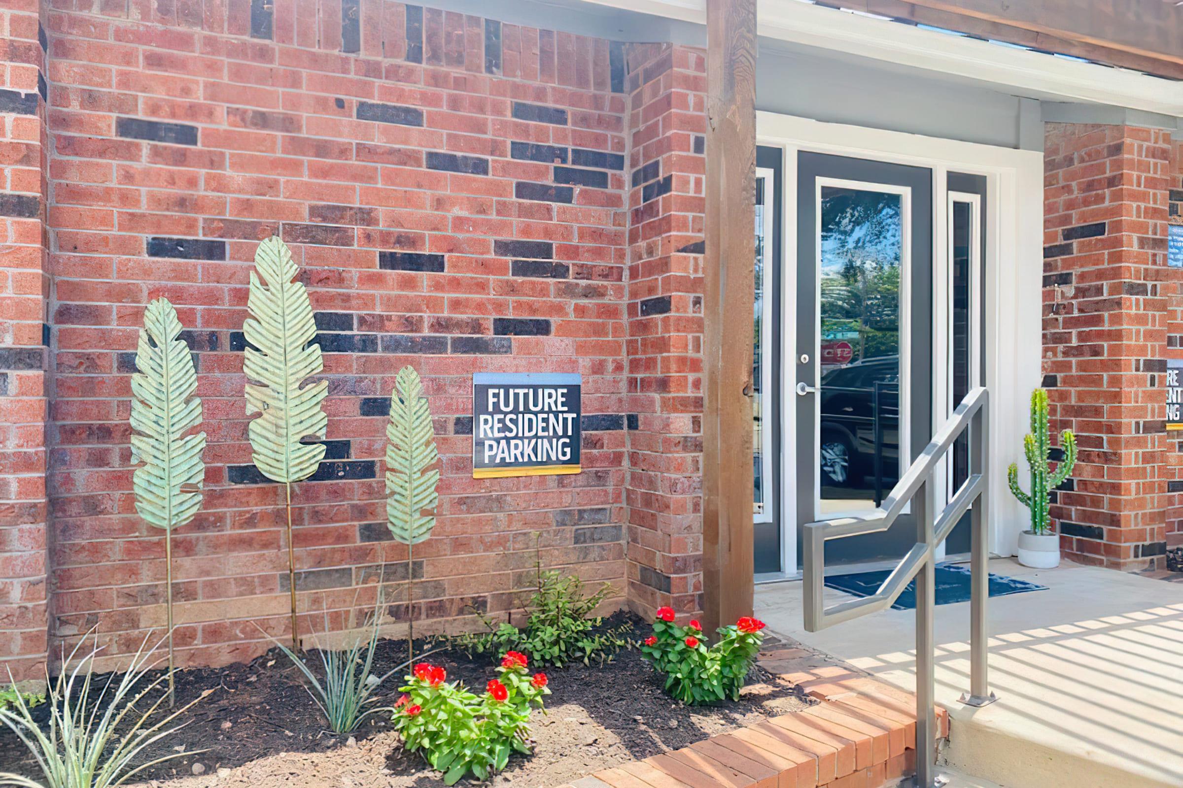 a sign in front of a brick building