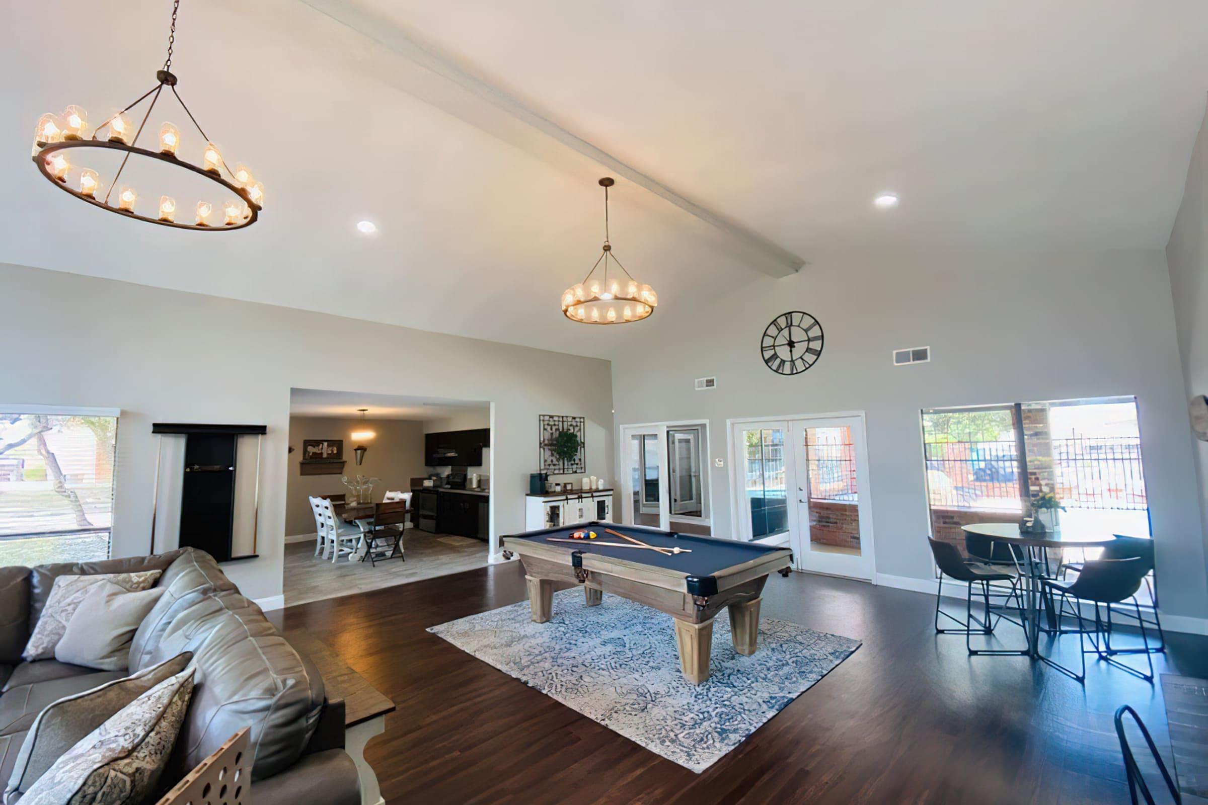 a living room filled with furniture and a flat screen tv