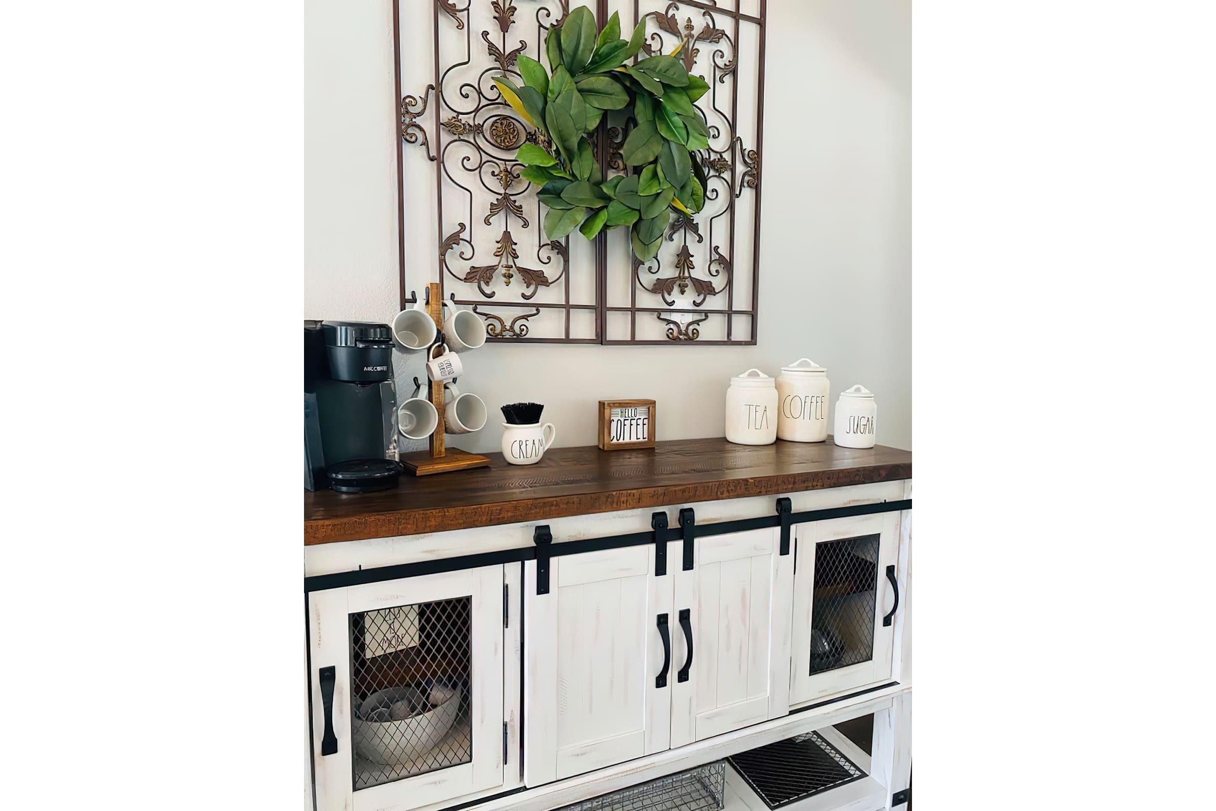 a kitchen with a sink and a mirror