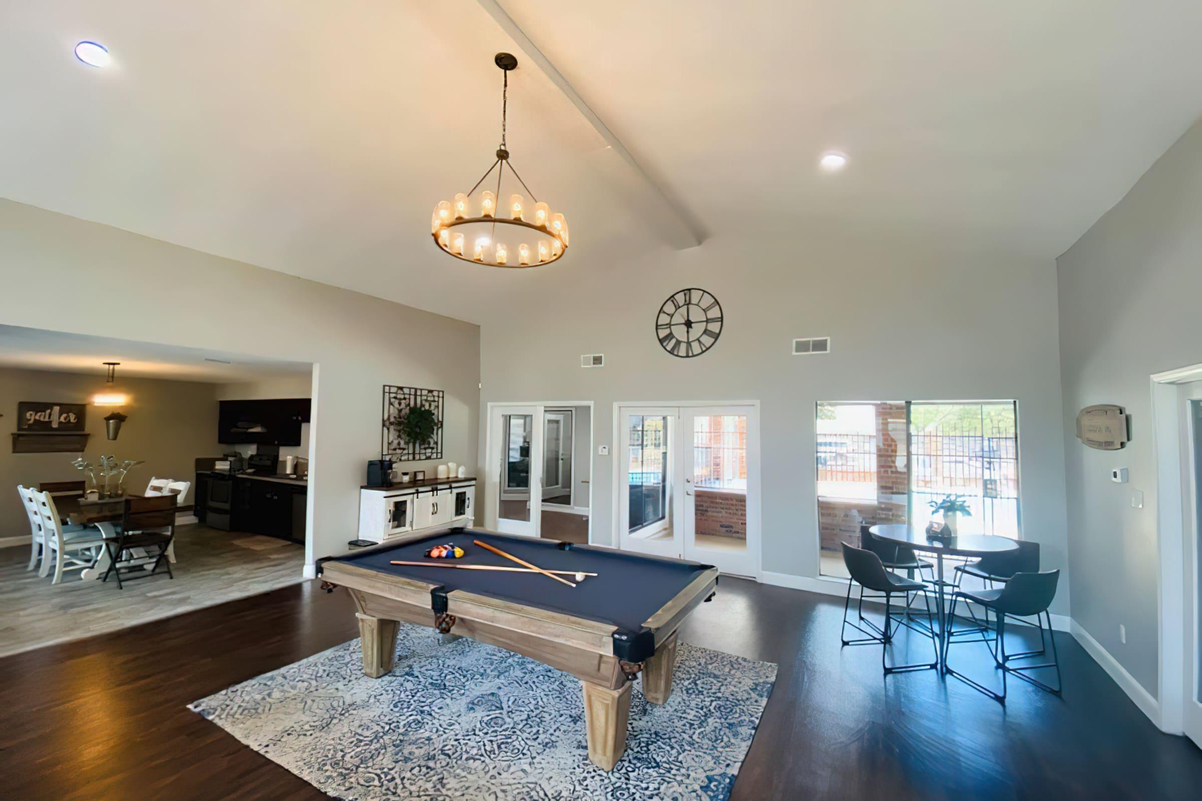 a living room filled with furniture and a table