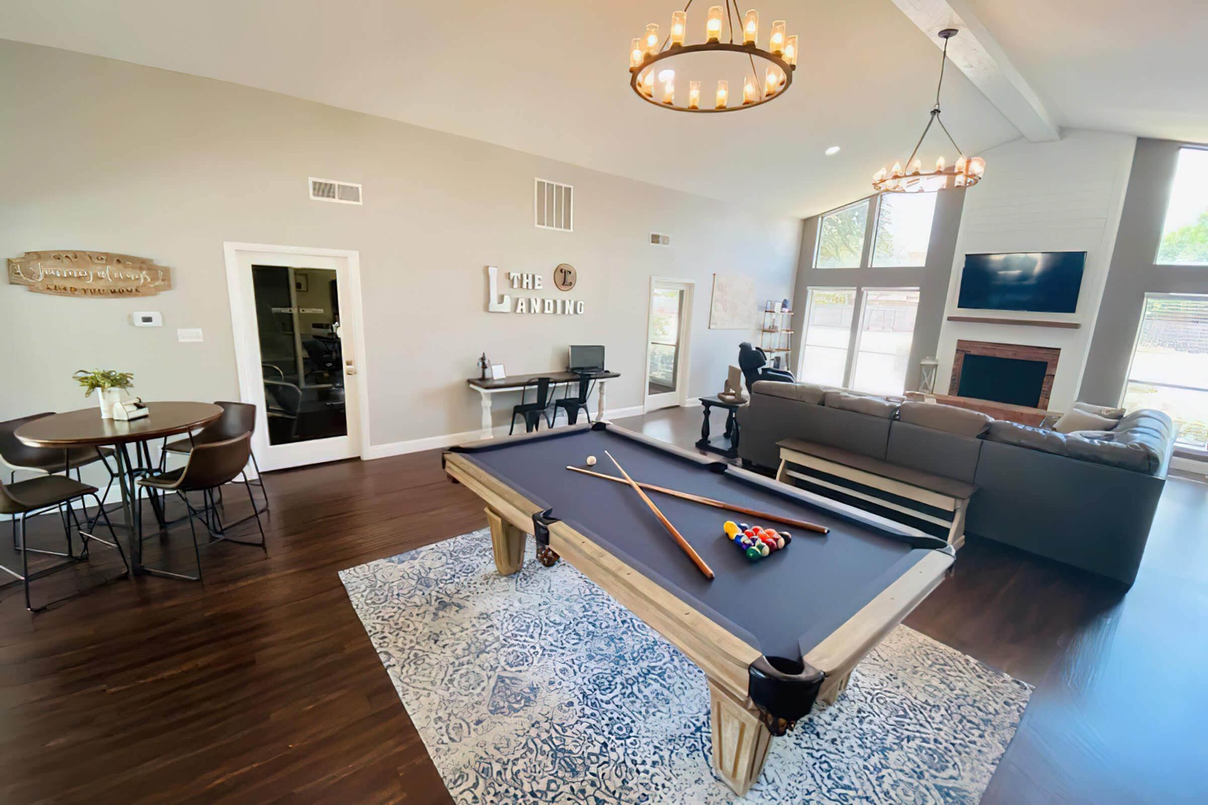 a living room filled with furniture and a large window